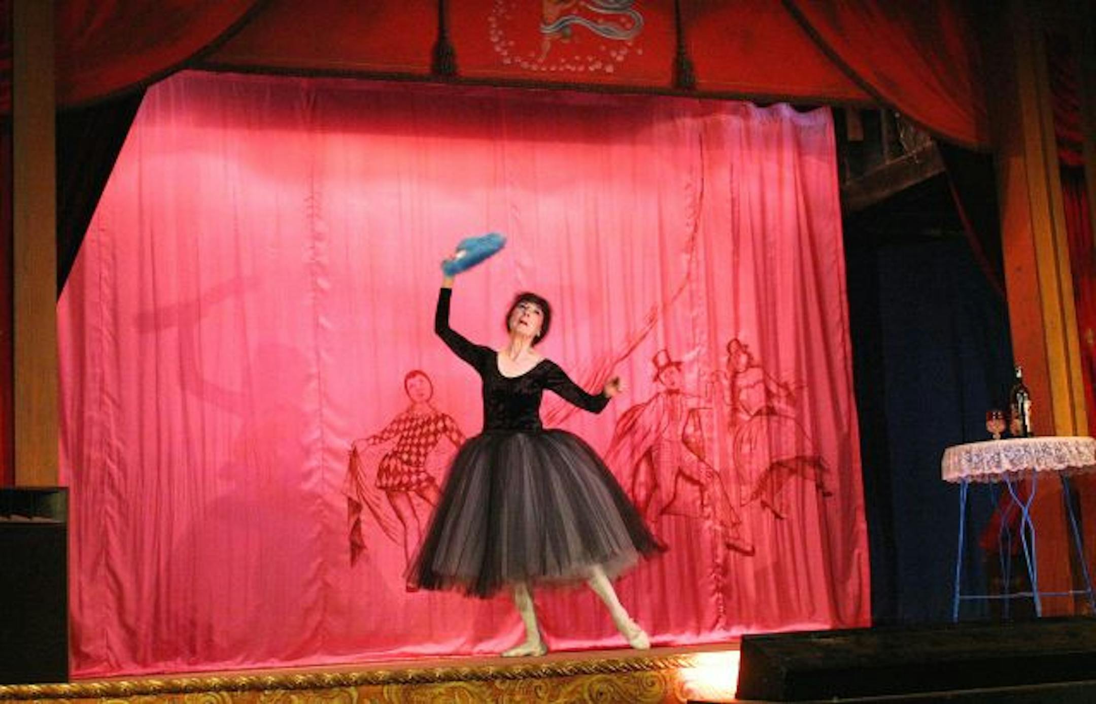 Madam Marta Becket, 79, can be found on certain afternoons drifting about the adobe colonnades wearing a black boa, gold hoop earrings, soft shoes and blue eye shadow. Becket is the resident diva of the California desert ghost town known as Death Valley Junction, the star of the Amargosa Opera House, its owner, manager, choreographer, seamstress, prop master and ticket taker. Becket during a perfoamance at the opera house on Jan 10, 2004.