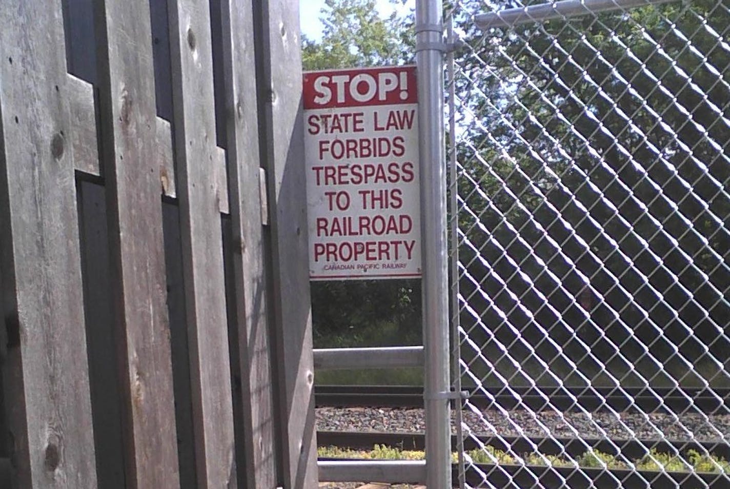 A ladder is part of the fence that runs between tracks and Webber Park in north Minneapolis.