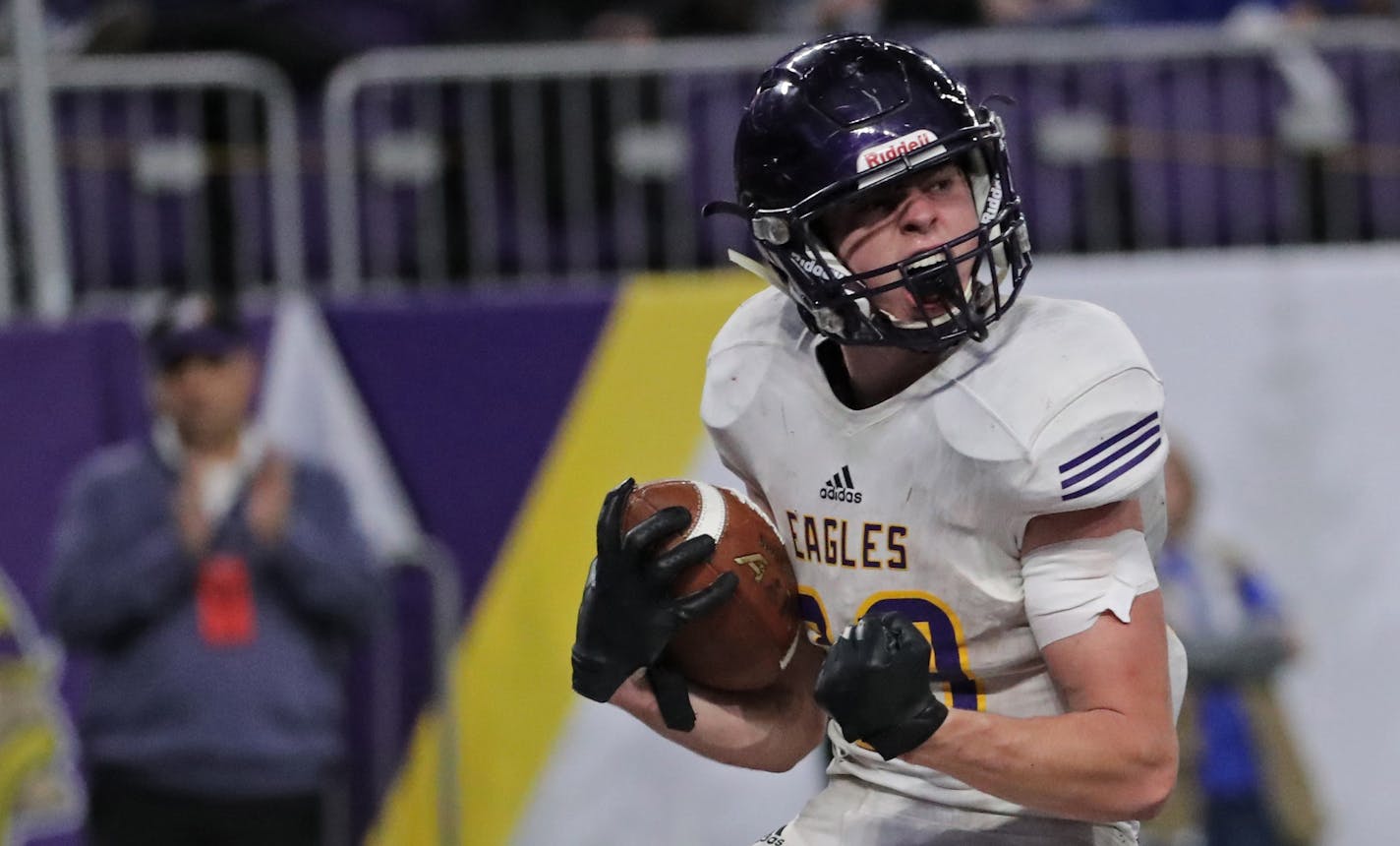 Rochester Lourdes' Zach Jungels (29) celebrated after scoring a touchdown in the fourth quarter. ] Shari L. Gross • shari.gross@startribune.com