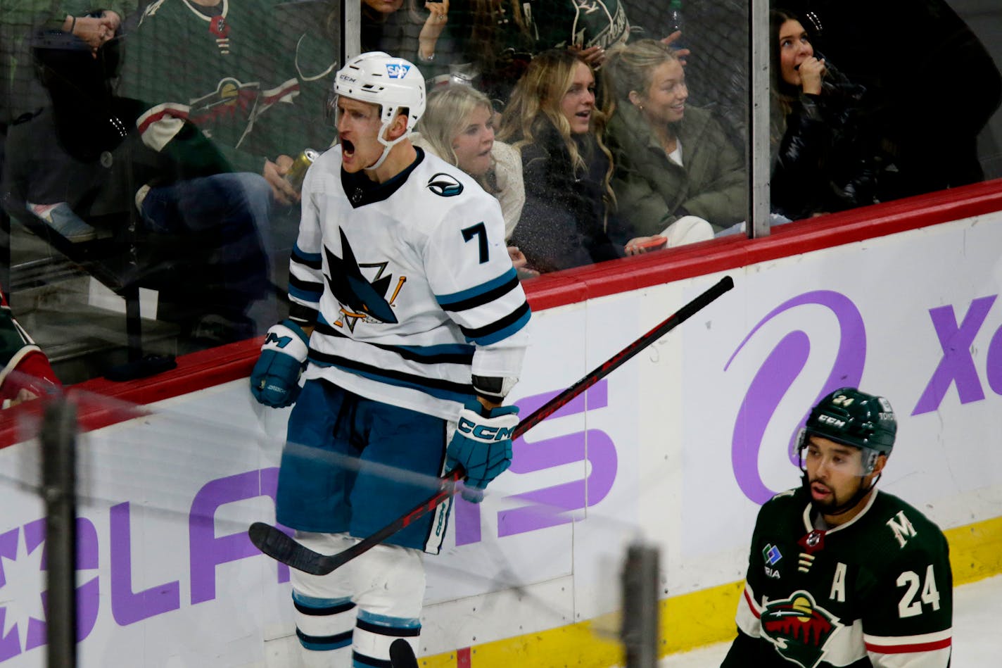 San Jose Sharks center Nico Sturm (7) celebrates after scoring a goal as Minnesota Wild defenseman Matt Dumba (24) looks on in the third period during an NHL hockey game Sunday, Nov. 13, 2022, in St. Paul, Minn. (AP Photo/Andy Clayton-King)