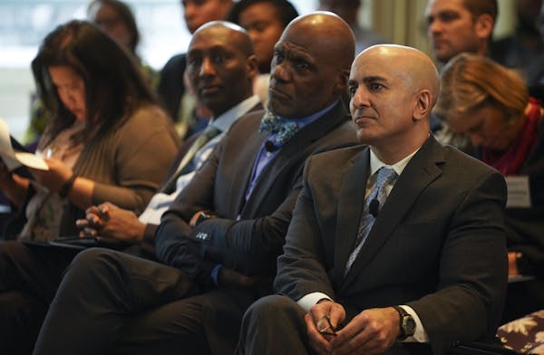 Retired Justice Alan Page, center, and Minneapolis Federal Reserve President Neel Kashkari, right, at Monday's forum.
