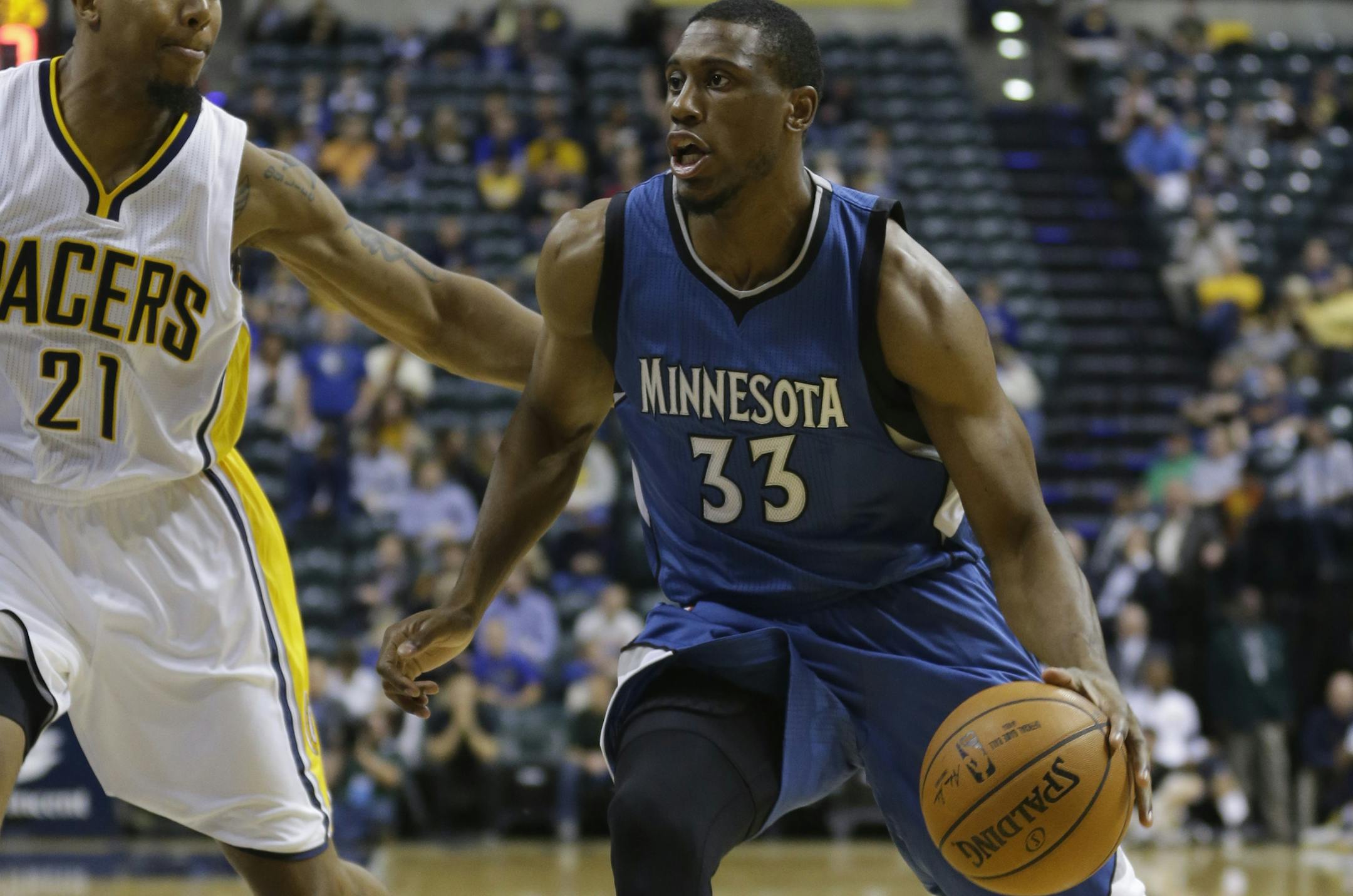 Wolves forward Thaddeus Young, right, drove on Pacers forward David West during the first half.
