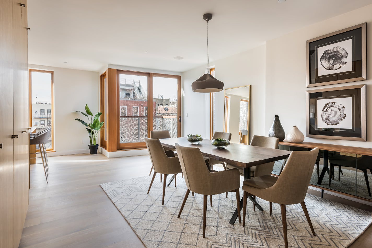 An elegant fixture adds appeal in this dining area.