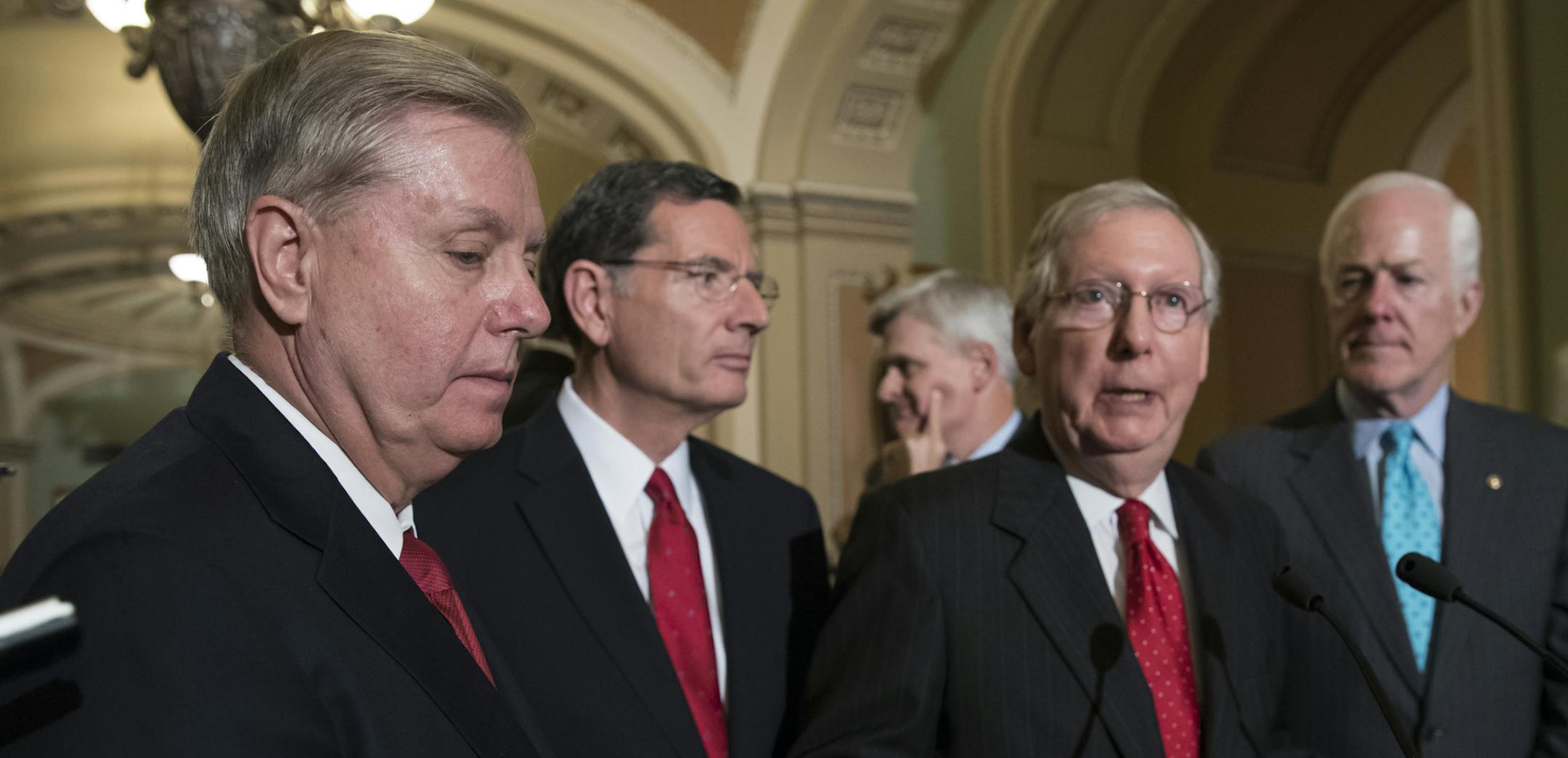 From left, Sen. Lindsey Graham, R-S.C., Sen. John Barrasso, R-Wyo., Sen. Bill Cassidy, R-La., Senate Majority Leader Mitch McConnell, R-Ky., and Majority Whip John Cornyn, R-Texas, speak to reporters as they faced assured defeat on the Graham-Cassidy bill, the GOP's latest attempt to repeal the Obama health care law, at the Capitol in Washington, Tuesday, Sept. 26, 2017. The decision marked the latest defeat on the issue for President Donald Trump and Senate Majority Leader Mitch McConnell in th