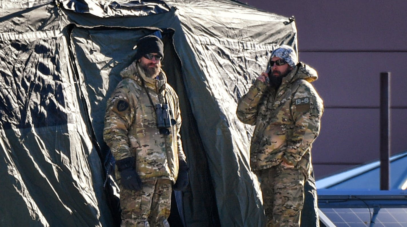 Bearded military personnel kept an eye out from a tent on the roof of the Minneapolis Convention Center. ] GLEN STUBBE &#x2022; glen.stubbe@startribune.com Monday, January 29, 2018 Short item on increased military presence downtown. Look for increased military presence along Nicollet Mall or elsewhere downtown.