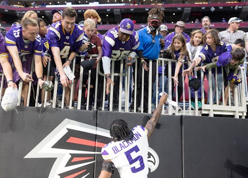 Vikings cornerback Mekhi Blackmon (5) gives a fan his gloves after the Vikings defeated Atlanta 31-28 at Mercedes-Benz Stadium in Atlanta, Georgia, on Friday, Nov. 3, 2023. ] Elizabeth Flores • liz.flores@startribune.com