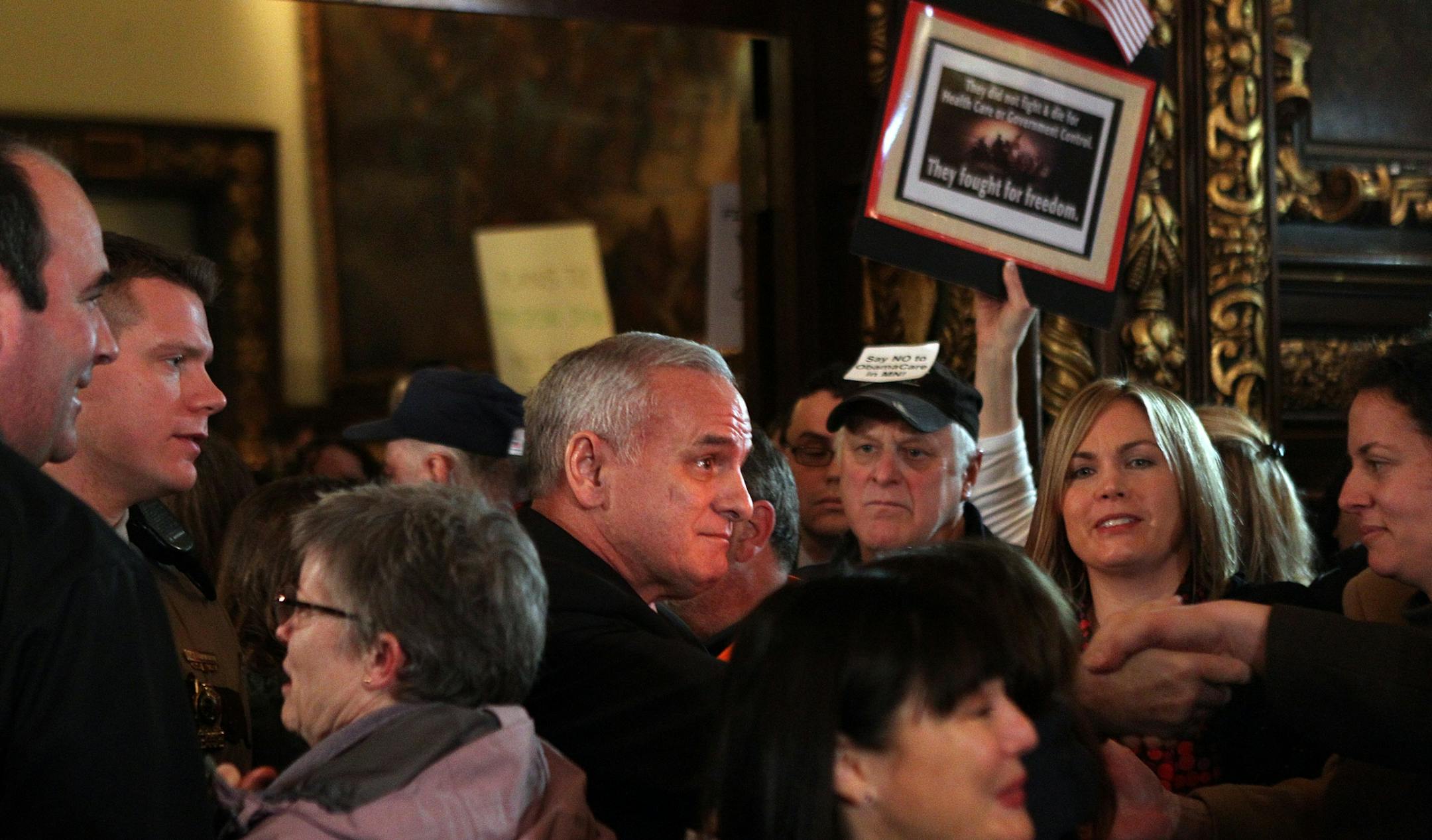 Gov. Mark Dayton greeted members of the crowd. Two opponents and two supporters of his orders on health care got to speak their piece.