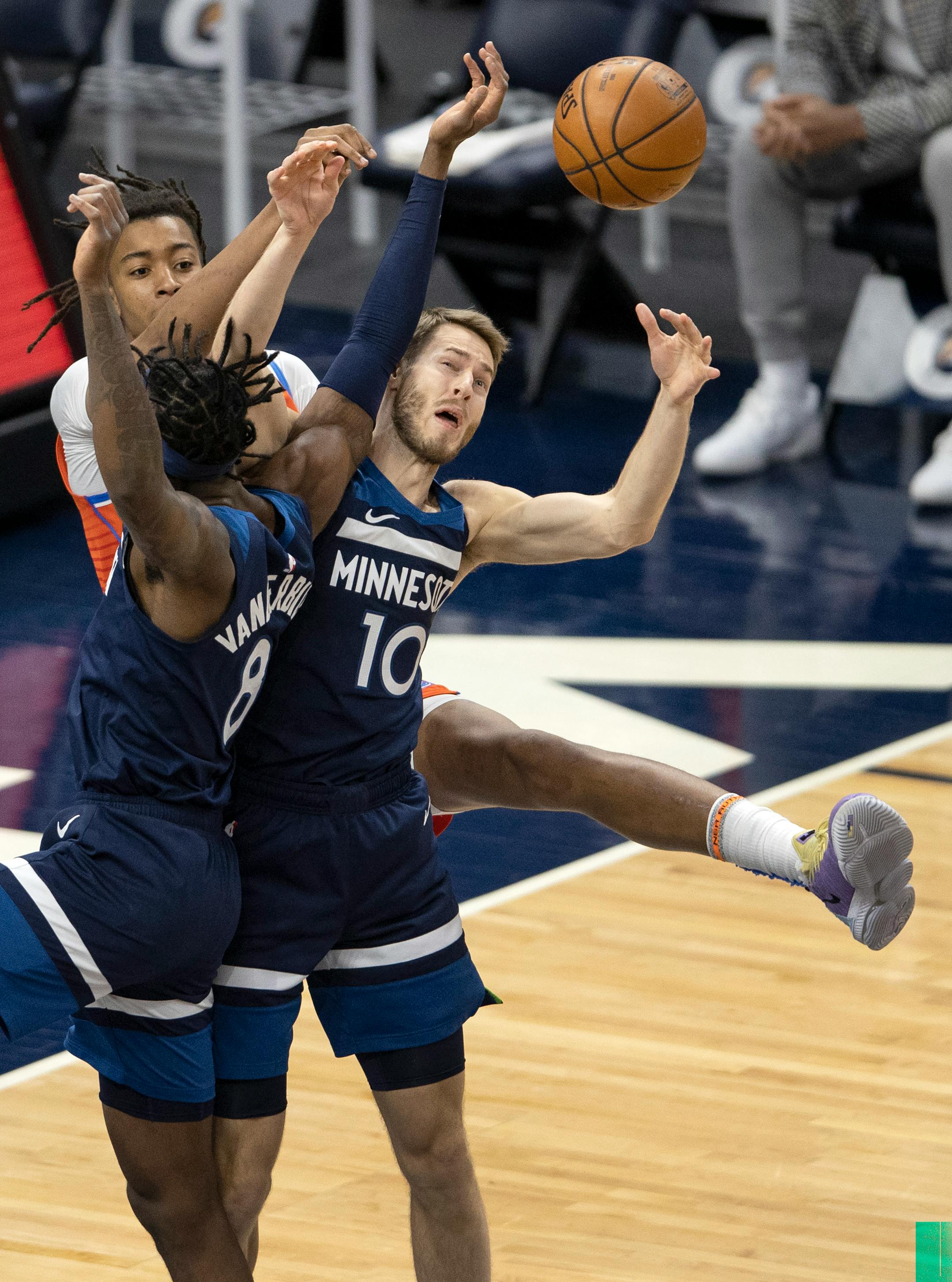Jarred Vanderbilt (8) and Jake Layman (10) of the Minnesota Timberwolves went up for a loose ball in the first quarter.