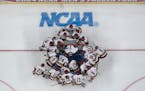 Boston College players huddle before the Frozen Four championship game against Denver.