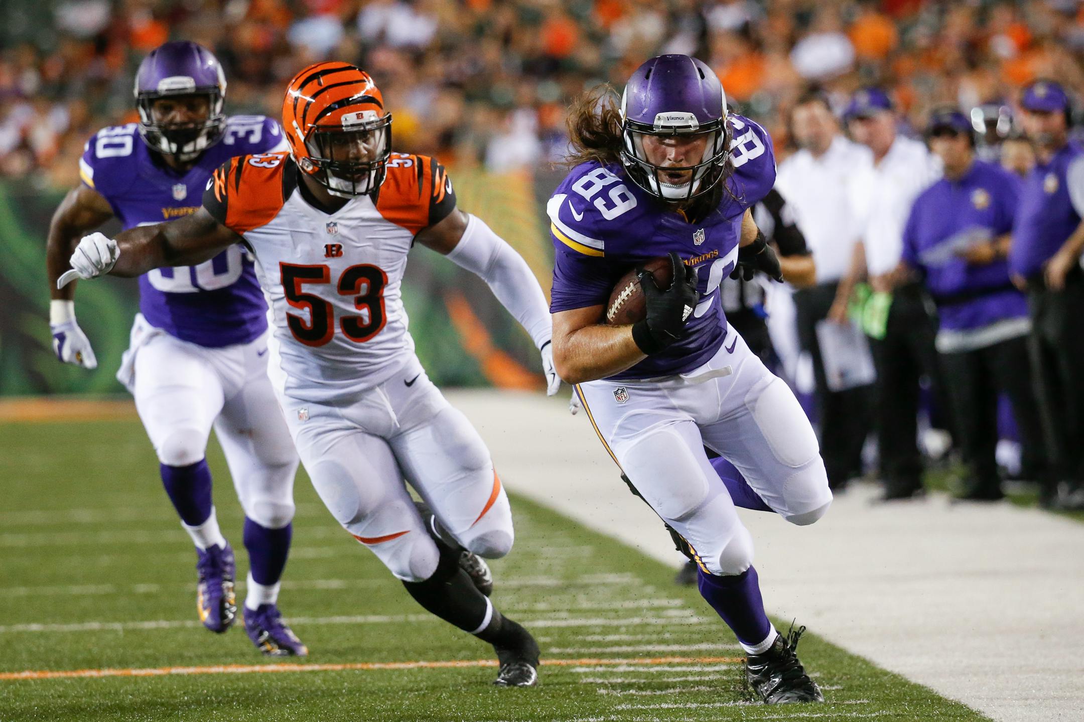 Minnesota Vikings tight end David Morgan (89) runs the ball as Cincinnati Bengals outside linebacker Marquis Flowers (53) pursues during the second half of an NFL preseason football game, Friday, Aug. 12, 2016, in Cincinnati. (AP Photo/Gary Landers)