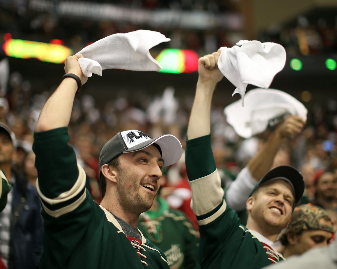 Fans celebrated after the second Wild insurance goal in the third period Monday night at Xcel Energy Center. ] JEFF WHEELER � jeff.wheeler@startribune.com The MInnesota Wild beat the Colorado Avalanche 5-2 in game 6 of their NHL playoff series Monday night, April 28, 2014, at Xcel Energy Center in St. Paul. ORG XMIT: MIN1404282326102455