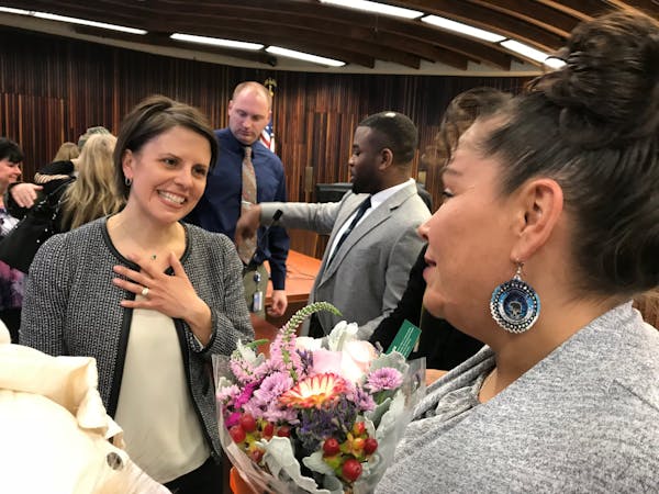 Marta Chou (left), the presiding judge for the Hennepin County Drug Court, congratulated Melissa Williams after the ceremony for 24 men and women grad