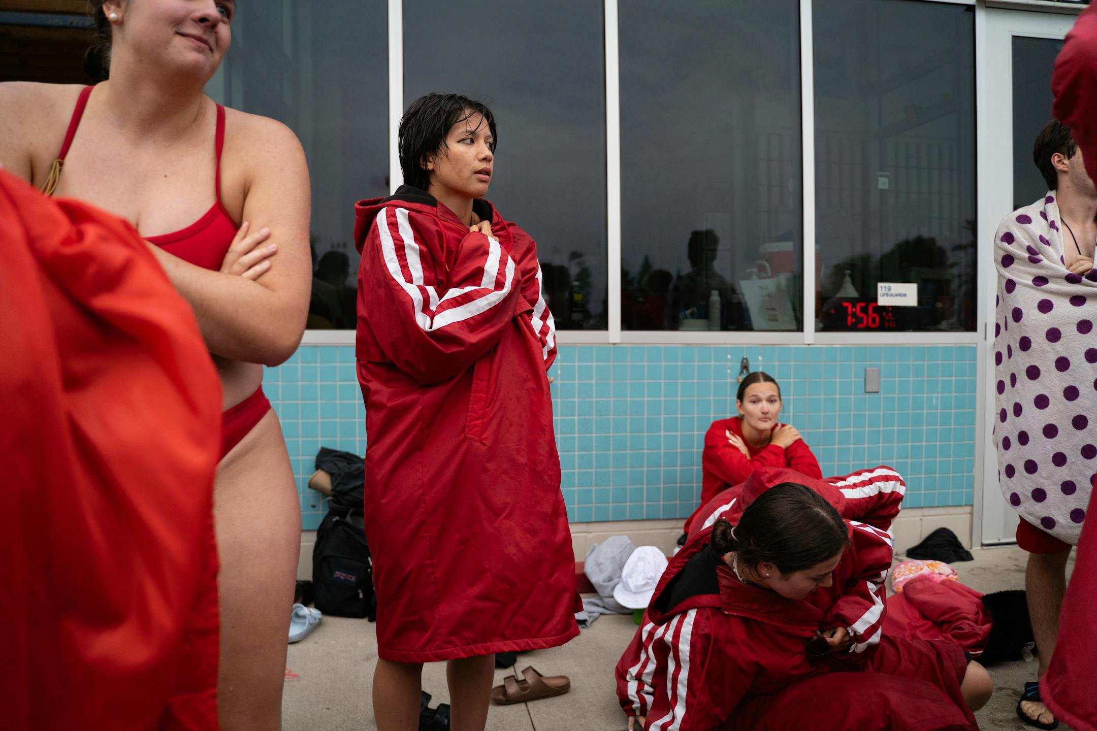 Lifeguards in training wait for the next drill during lifeguard lessons.