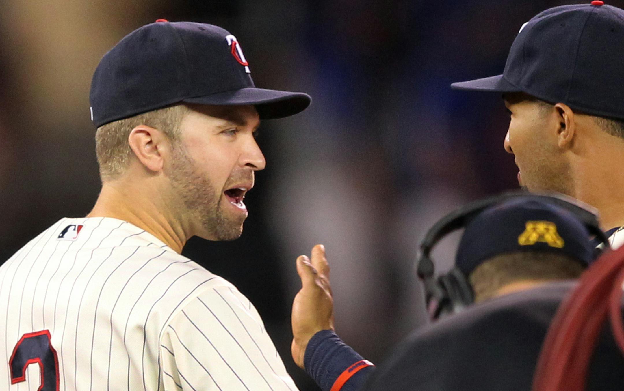 Minnesota Twins Brian Dozier (2) is congratulated by Twins' Eddie Rosario after defeating the Kansas City Royals on Saturday, Aug., 13, 2016, in Minneapolis. The Twins defeated the Royals 5-3.(AP Photo/Andy Clayton-King)
