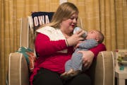 Melissa Ellis fed baby Kai Sanborn as she put him back to sleep during her overnight doula shift on Wednesday, October 25, 2017, in Maple Grove, Minn.