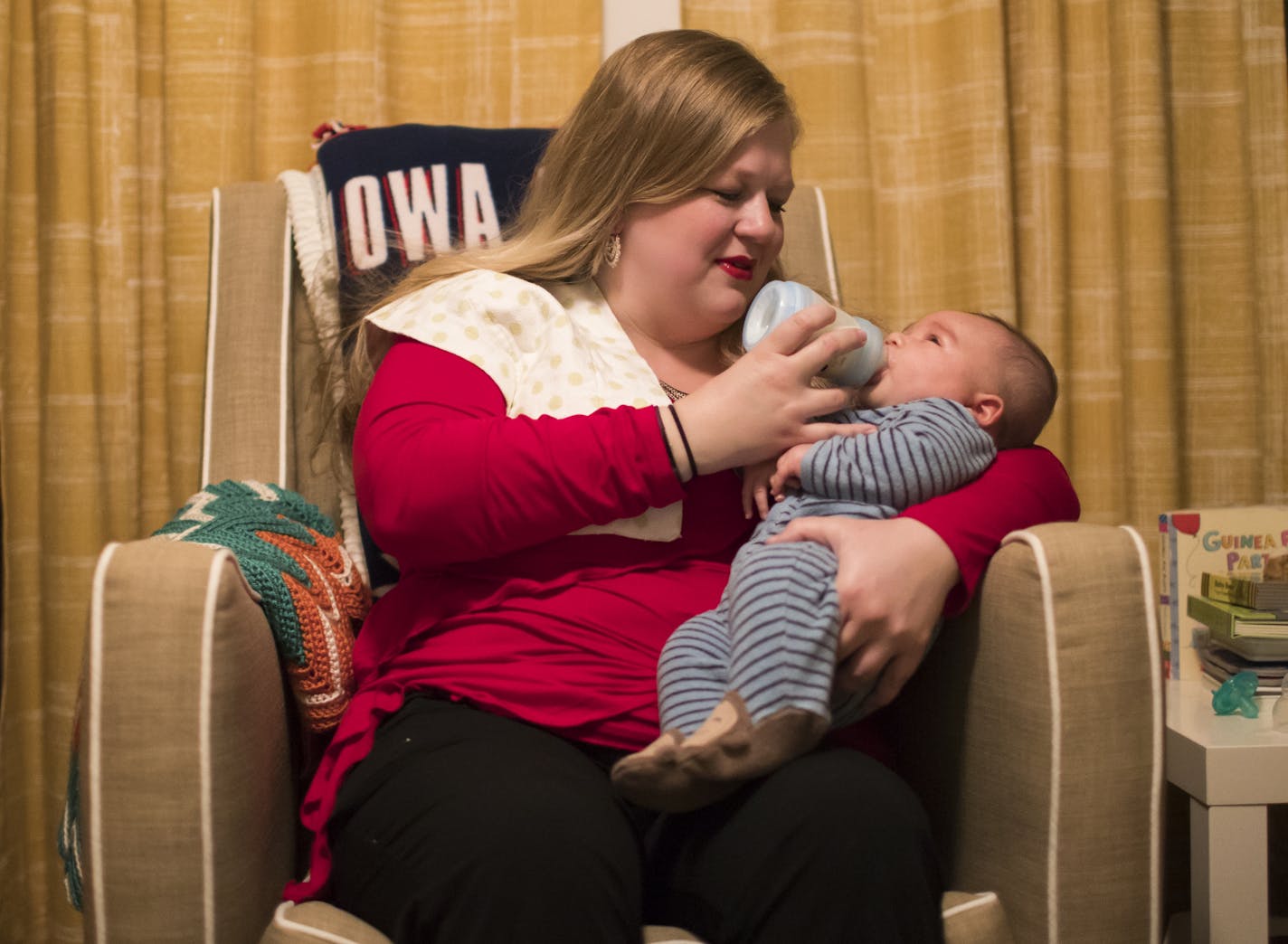 Melissa Ellis fed baby Kai Sanborn as she put him back to sleep during her overnight doula shift on Wednesday, October 25, 2017, in Maple Grove, Minn. Kelly Sanborn, Kai's mother, was sleeping in the next room and Ellis was helping do an overnight shift waking with Kai so Kelly could sleep. Kelly has had postpartum depression and Ellis acts as a support to Kelly and her husband. ] RENEE JONES SCHNEIDER &#x2022; renee.jones@startribune.com