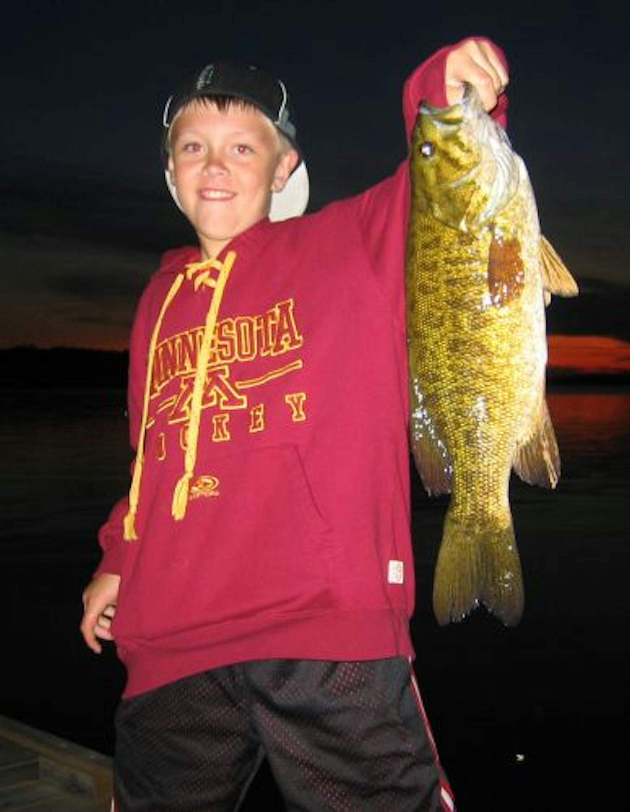 Kyle Pearson, 10, of Rochester caught this 21-inch smallmouth bass off a dock on Pelican Lake in Orr.