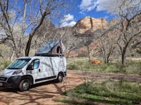 Campervan parked in Watchman Campground at Zion National Park.