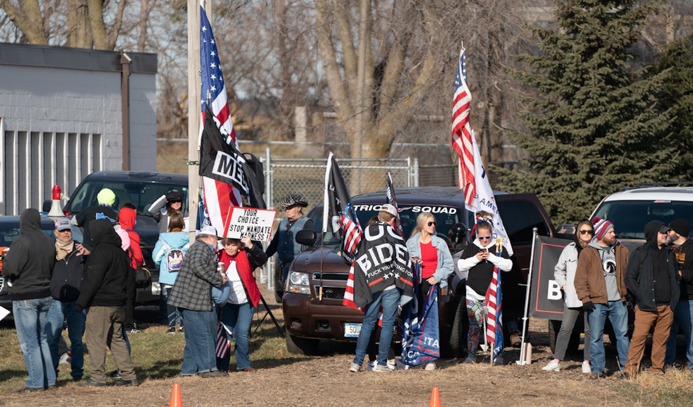 Groups of Trump supporters gathered across from DCTC before the President arrived. President Joe Biden travelled to Rosemount, Minn., Tuesday, Nov. 30, 2021, where he visited Dakota County Technical College, which has programs to train the next generation of workers to build, operate, and maintain infrastructure supported by the Bipartisan Infrastructure Law. ] GLEN STUBBE • glen.stubbe@startribune.com