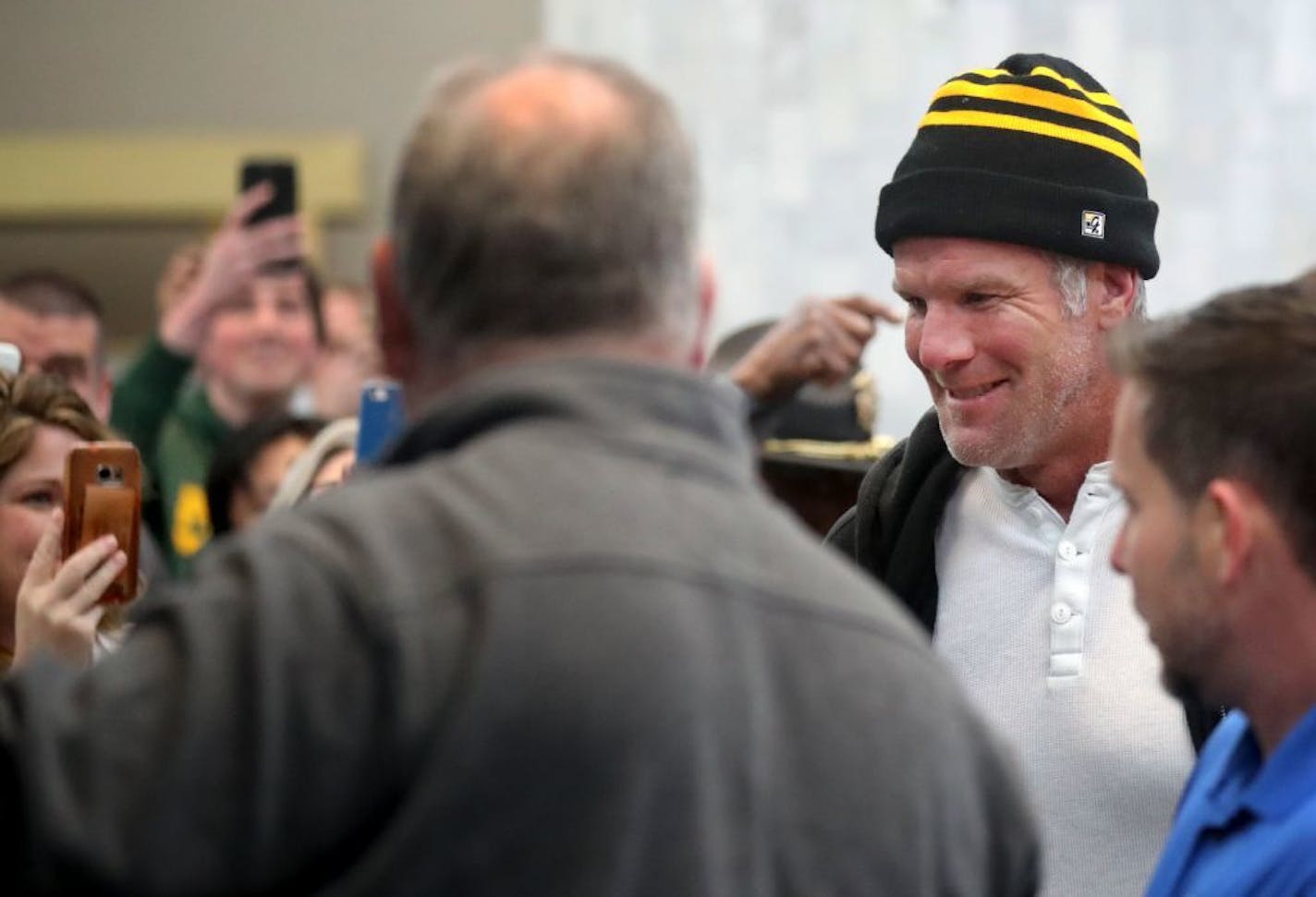 Former Green Bay Packers and Minnesota Vikings quarterback Brett Favre arrives to the glee of fans before posing with fans for photos and signing autographs at Ridgedale Mall Saturday, Feb. 3, 2018, in Minnetonka, MN.