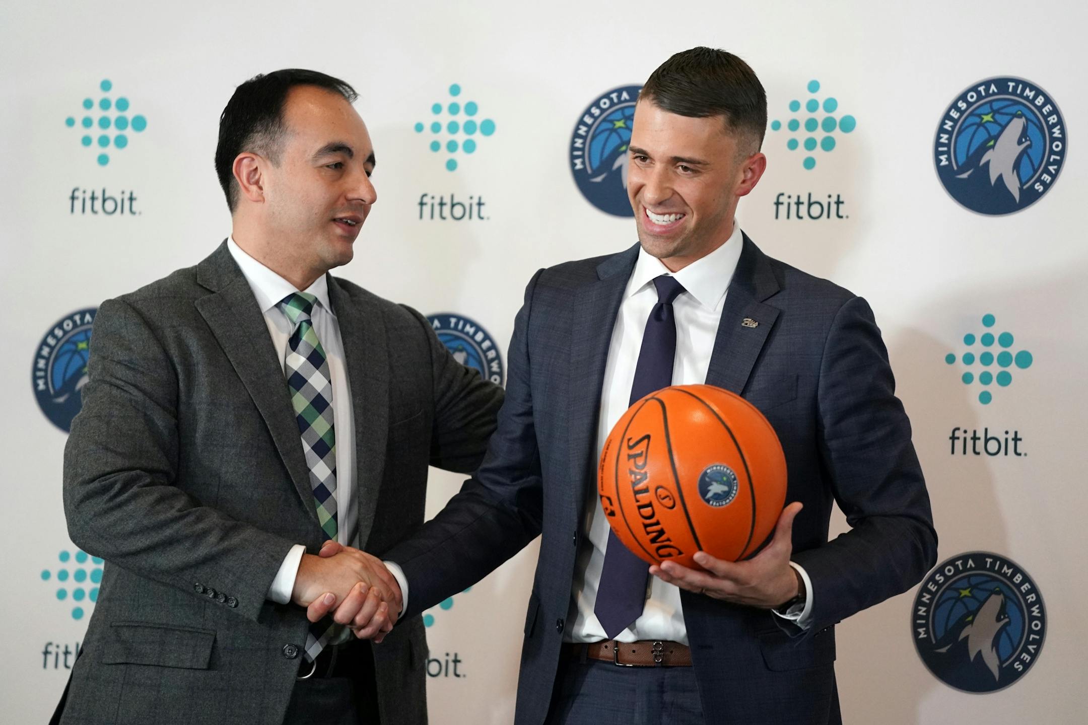 Newly named Timberwolves coach Ryan Saunders got a handshake from President of Basketball Operations Gersson Rosas following Tuesday's news conference.