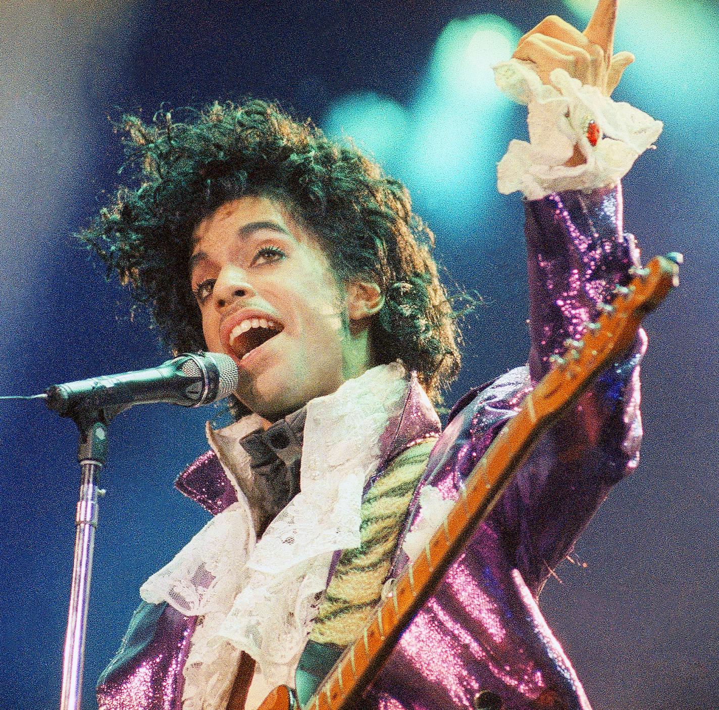 FILE - In this Feb. 18, 1985 file photo, Prince performs at the Forum in Inglewood, Calif. Prince's heirs have sued Walgreens and the Illinois hospital that treated the music superstar after he suffered from an opioid overdose, alleging that a doctor and various pharmacists failed to provide Prince with reasonable care, contributing to his death. (AP Photo/Liu Heung Shing, File)