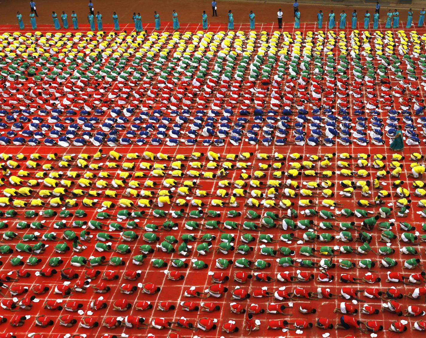 Indian students practice yoga at a school ahead of the first International Yoga Day, in Chennai, India, Friday, June 19, 2015. Sunday marks the first International Yoga Day, which the government of Prime Minister Narendra Modi is marking with a massive outdoor New Delhi gathering. (AP Photo/Arun Sankar K)