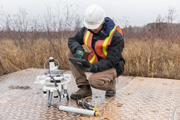 A Talon Metals technologists checks drilling samples at the company’s proposed nickel-copper mine near Tamrack, about 40 miles west of Duluth.