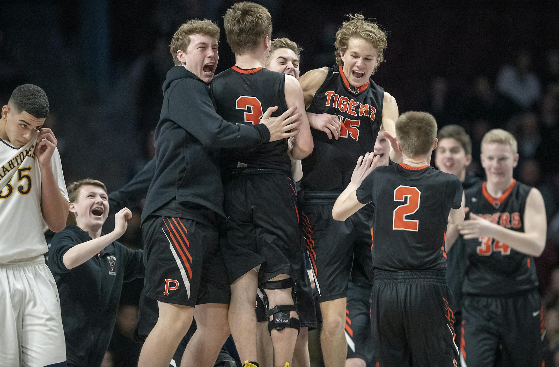 The Princeton Tigers celebrated their 68-63 win over Mahtomedi after their matchup in the boys' basketball state tournament 3A quarterfinals, Wednesday, March 20, 2019 at Williams Arena in Minneapolis, MN. ] ELIZABETH FLORES &#x2022; liz.flores@startribune.com