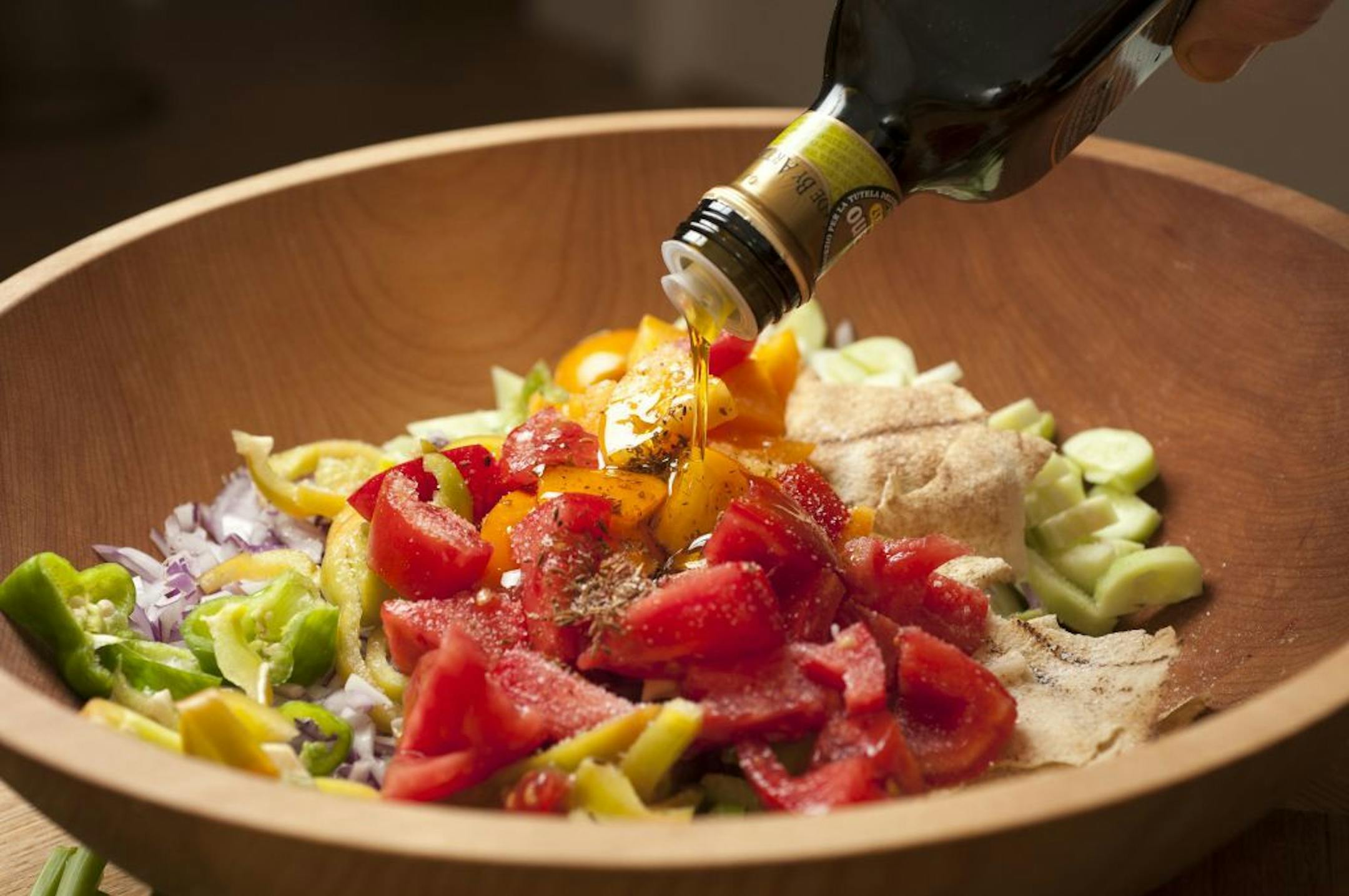 A bowl of fattoush, the Lebanese bread salad, in New York, Aug. 16, 2012. The salad is made with crisp toasted stale pita or other Arab flatbread; tomatoes, peppers and cucumbers; and an olive oil dressing with lots of sweet herbs.