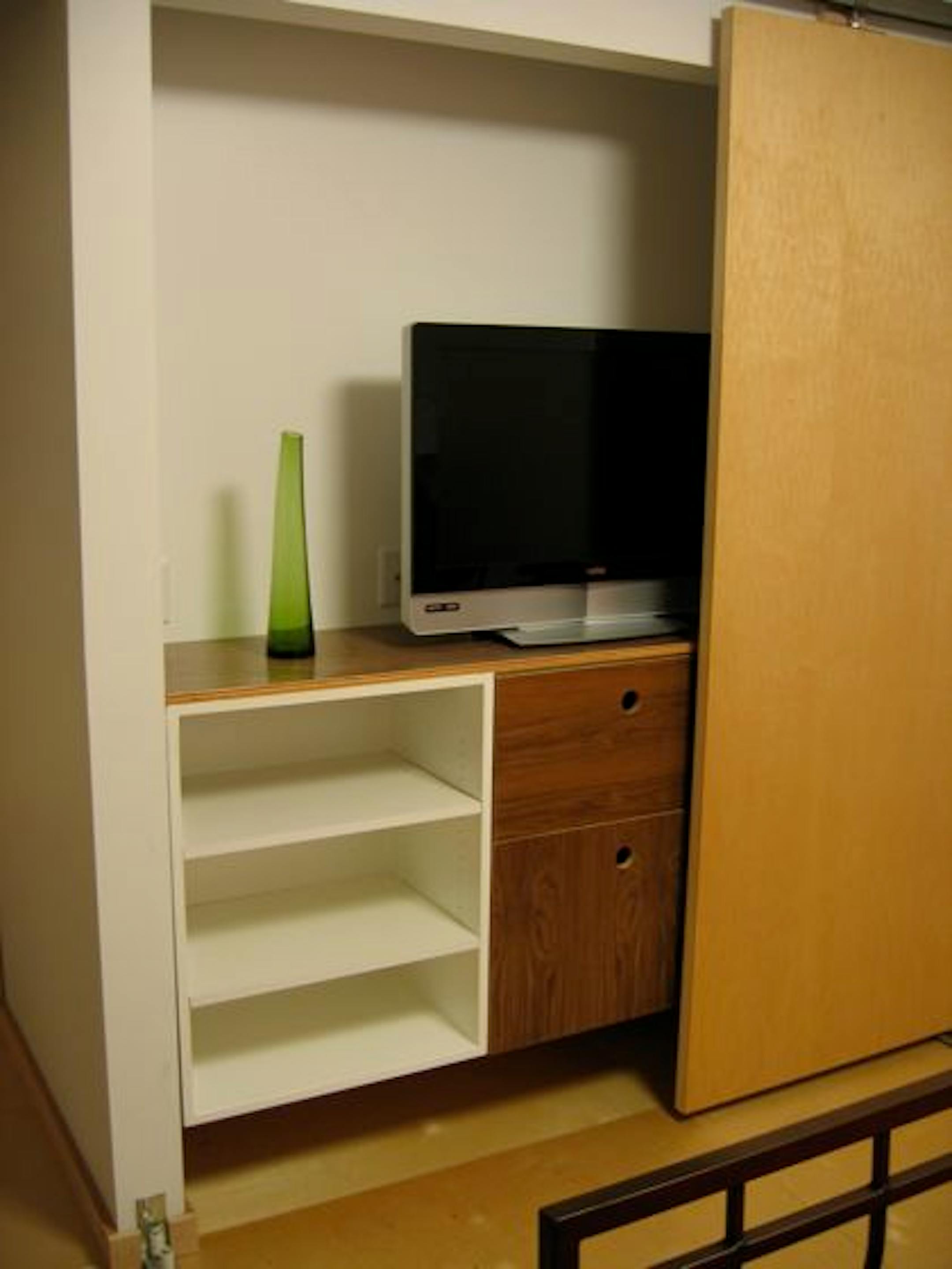 The cabinet was built in three parts from leftover walnut plywood for the doors and fiberboard for the boxes.