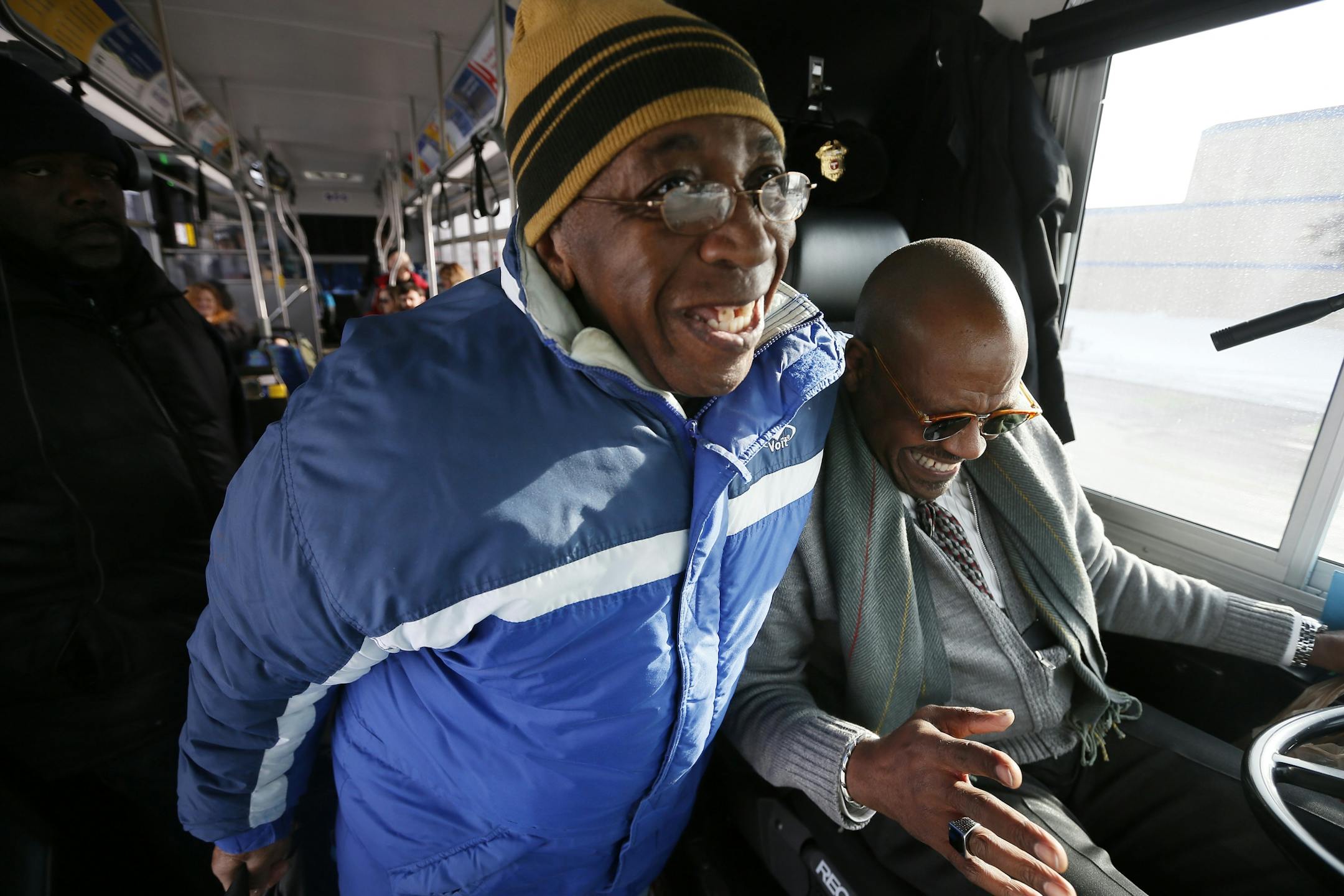 Jamie Bright 77, left a resident of North Minneapolis says his goodbye to Tony Taylor is retiring with 36 years of service as a Metro Transit bus driver January 14, 2015 Minneapolis, MN.