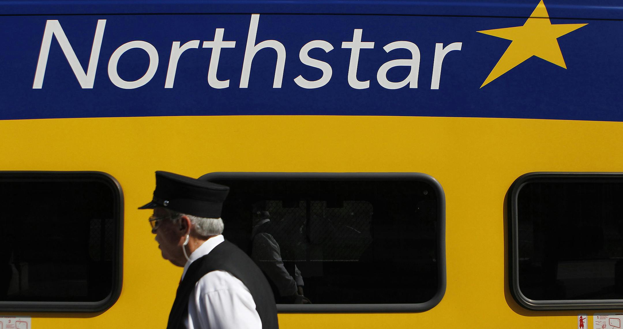 Conductor J.R. Long waked by the Northstar Commuter Rail at Target Field on Tuesday. ] CARLOS GONZALEZ ï cgonzalez@startribune.com , July 19, 2011, Target Field, Minneapolis, Minn, MLB, Minnesota Twins vs. Cleveland Indians ORG XMIT: MIN2012101613212730 ORG XMIT: MIN1412181850220249 ORG XMIT: MIN1605051606120483 ORG XMIT: MIN1703301417179620