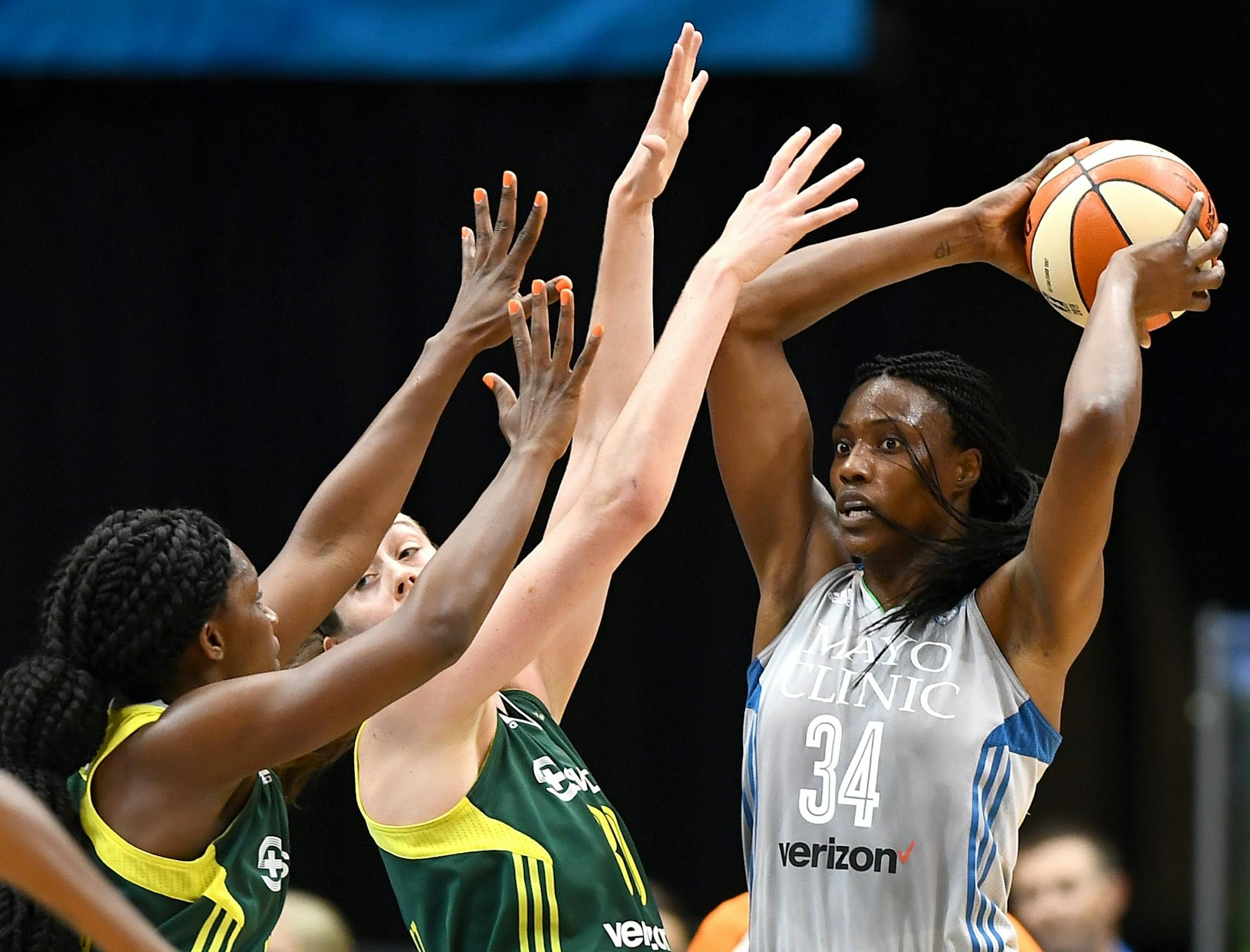 Minnesota Lynx center Sylvia Fowles (34) was double teamed by the Seattle Storm in the second half Friday.