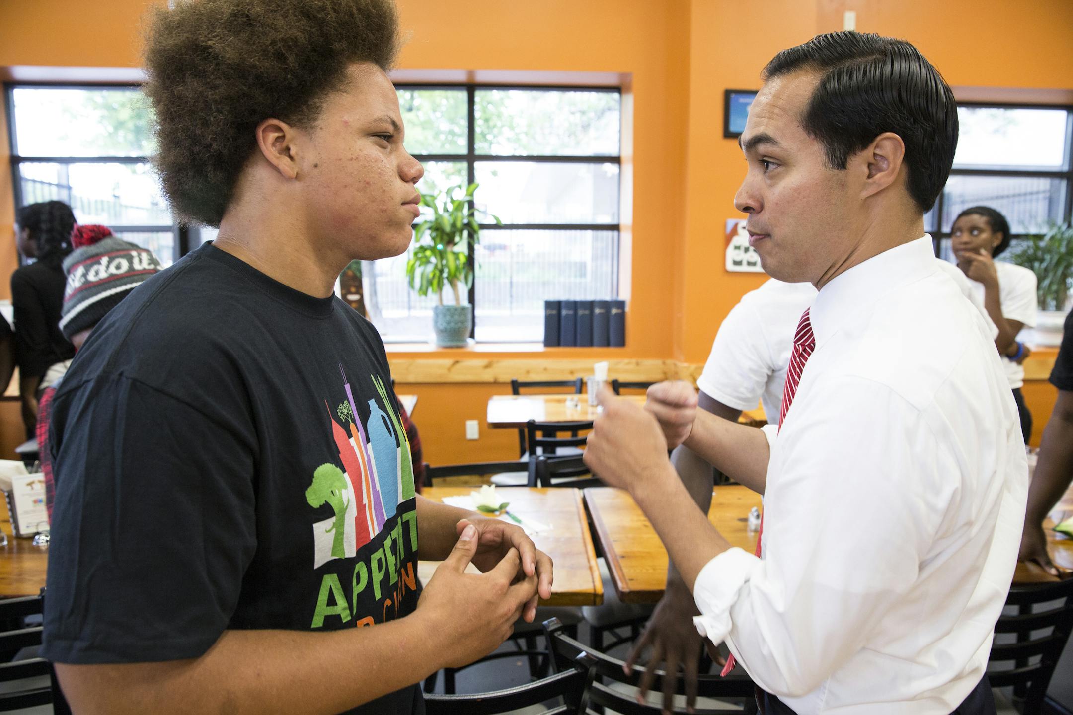 U.S. Department of Housing and Urban Development (HUD) Secretary Juli·n Castro talks to Appetite for Change youth intern Dakota Jewell, 15, while touring Breaking Bread Foods during a visit to the Minneapolis Promise Zone in north Minneapolis on Thursday, August 6, 2015. ] LEILA NAVIDI leila.navidi@startribune.com / BACKGROUND INFORMATION: In April, HUD announced the expansion of the Promise Zones Initiative to eight additional cities from across the country, including Minneapolis, MN.