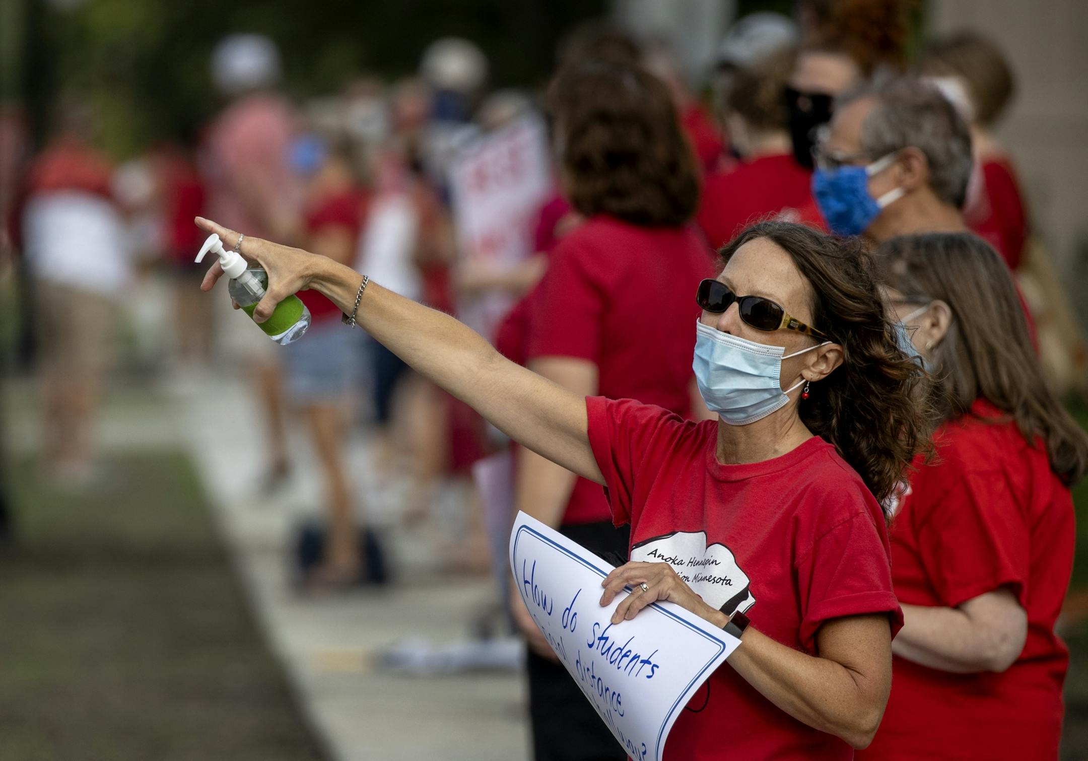 Teachers held a socially distanced rally before Monday's school board meeting at Sandburg Education Center in Anoka asking for safety and equity to be at the core of the Anoka-Hennepin School District's Fall education plans.