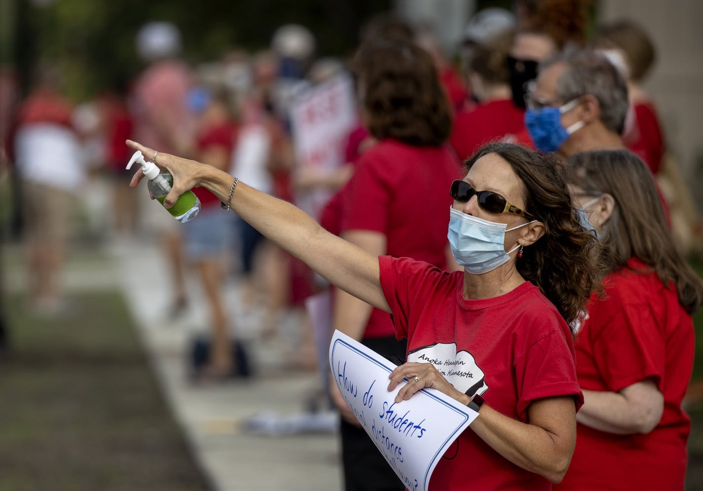 Teachers held a socially distanced rally before Monday's school board meeting at Sandburg Education Center in Anoka asking for safety and equity to be at the core of the Anoka-Hennepin School District's Fall education plans.