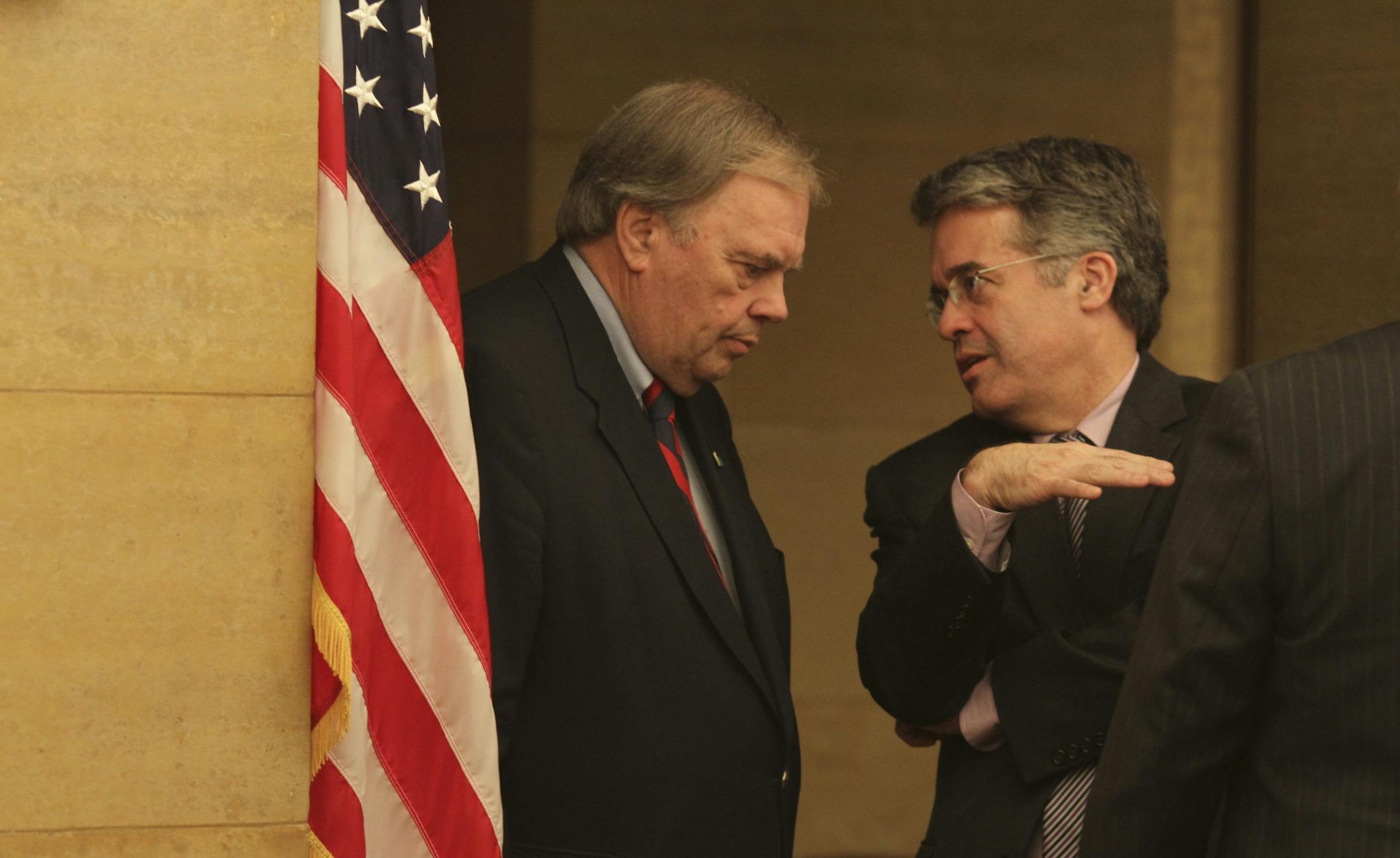 Rep. Morrie Lanning (R) talked with Rep Terry Morrow (DFL) before the conference committee meeting at the State Capitol in St. Paul, Min., Wednesday, May 9, 2012.