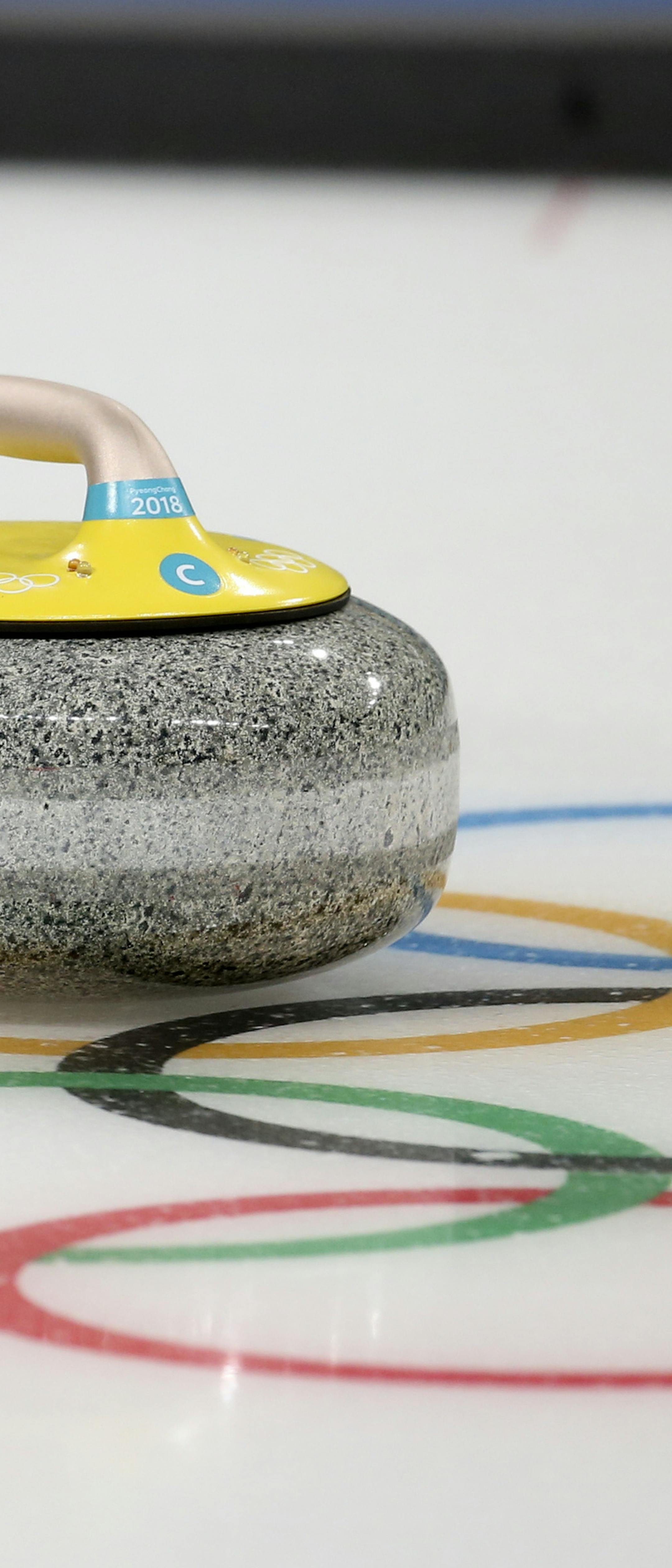 United States' Becca Hamilton throws a rock during a training session with her sibling and teammate Matt Hamilton ahead of the 2018 Winter Olympics in Gangneung, South Korea, Wednesday, Feb. 7, 2018. (AP Photo/Natacha Pisarenko)