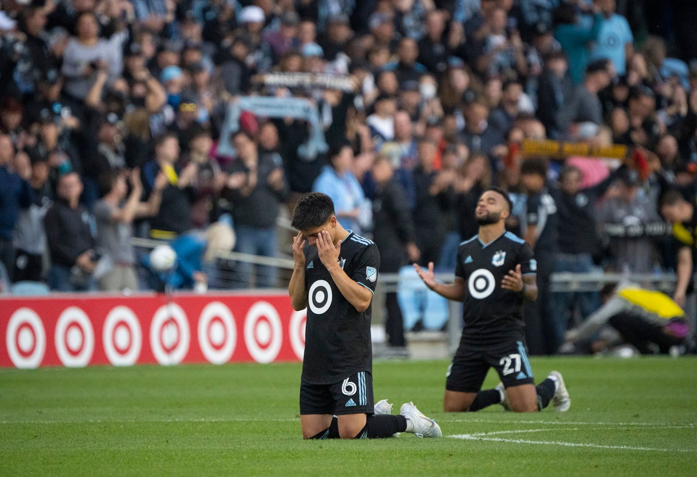 Minnesota United midfielder Jonathan Gonzalez (6) and teammate defender D.J. Taylor (27) dropped to their knees in thanks after the Loons won to advance to the playoffs Sunday afternoon, October 9, 2022 at Allianz Field in St. Paul. The Minnesota United FC shut out the Vancouver Whitecaps FC 2-0 in a Decision Day game. ] JEFF WHEELER • Jeff.Wheeler@startribune.com