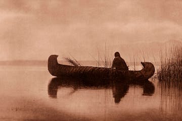 "Kutenai Duck Hunter," from northern Montana in 1910, captures daily life.
Edward S. Curtis' photos of North American Indians documented cultures unde