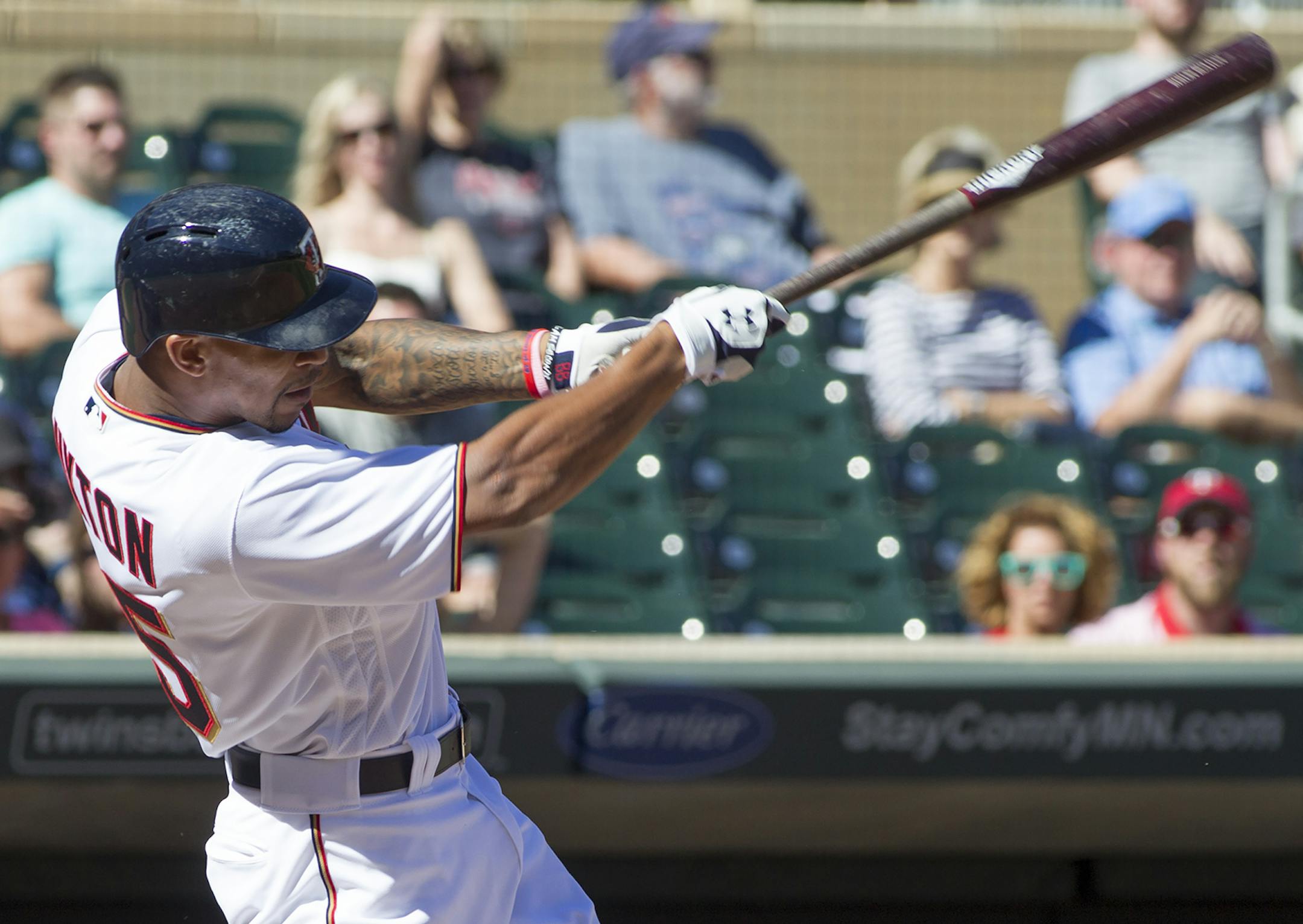 Minnesota Twins' Byron Buxton follows through on an RBI-single during the fourth inning of a baseball game, Sunday, Sept. 11, 2016, in Minneapolis. (AP Photo/Paul Battaglia) ORG XMIT: MIN2016091918505845