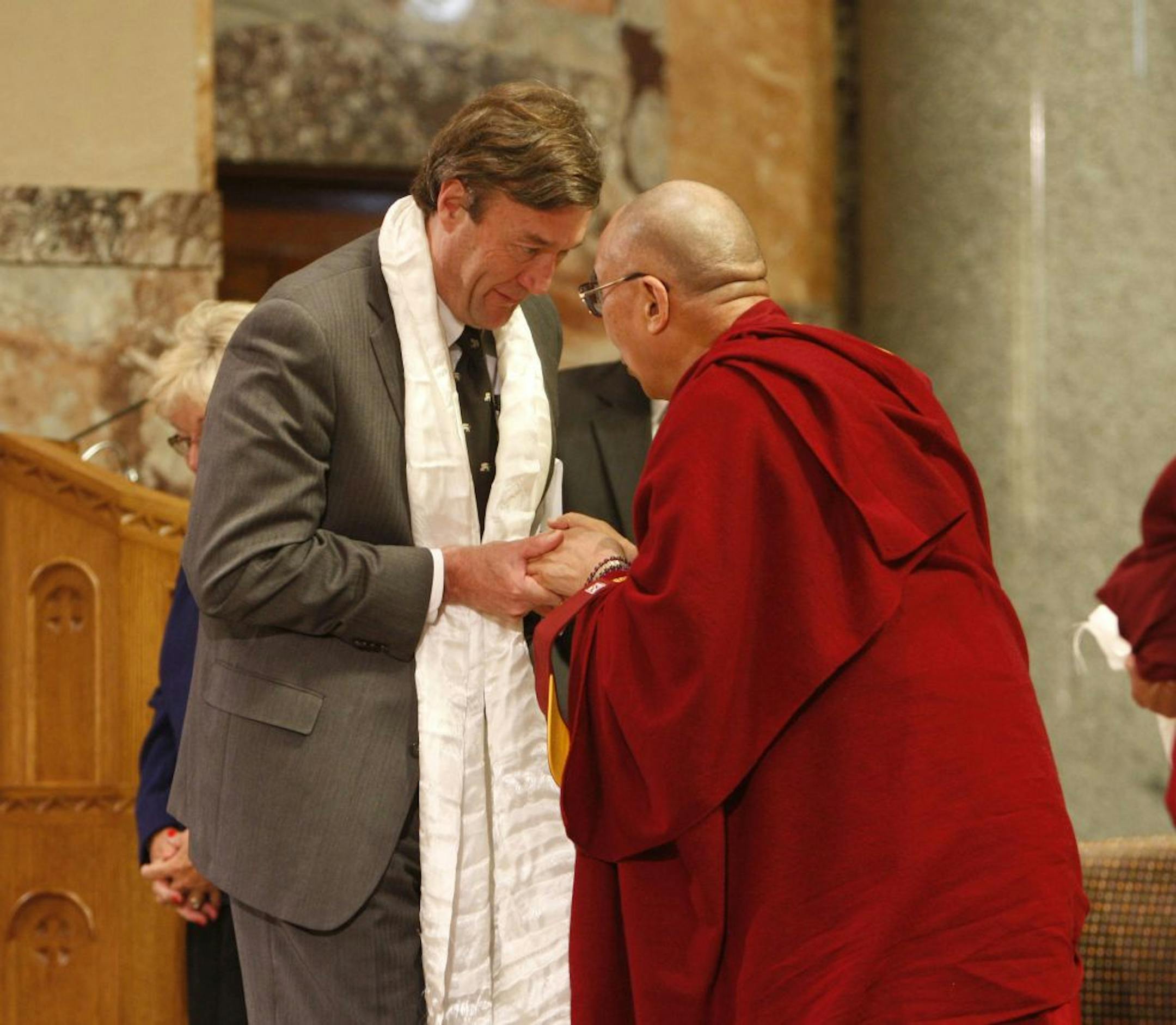 Dr. John Noseworthy, left, president and CEO of Mayo Clinic, greeted the Dalai Lama on Tuesday in the chapel at St. Marys Hospital in Rochester.