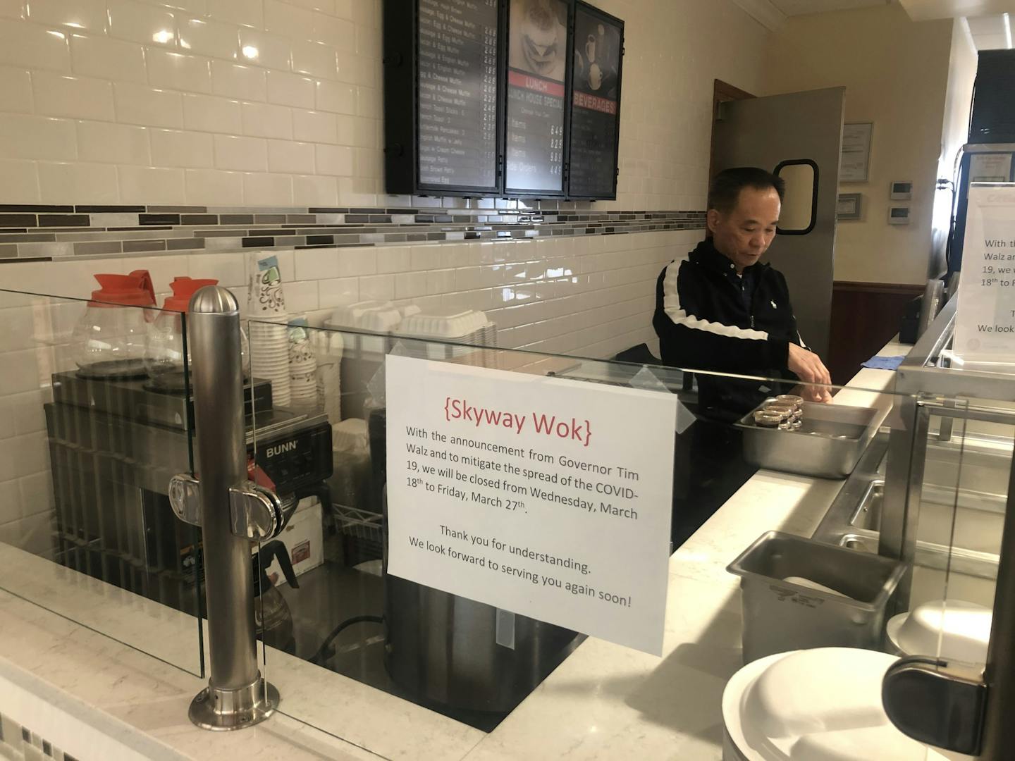 Tan Do finishes cleaning up Tuesday afternoon at his downtown Minneapolis restaurant, Skyway Wok, after deciding to close for most of the rest of the month.