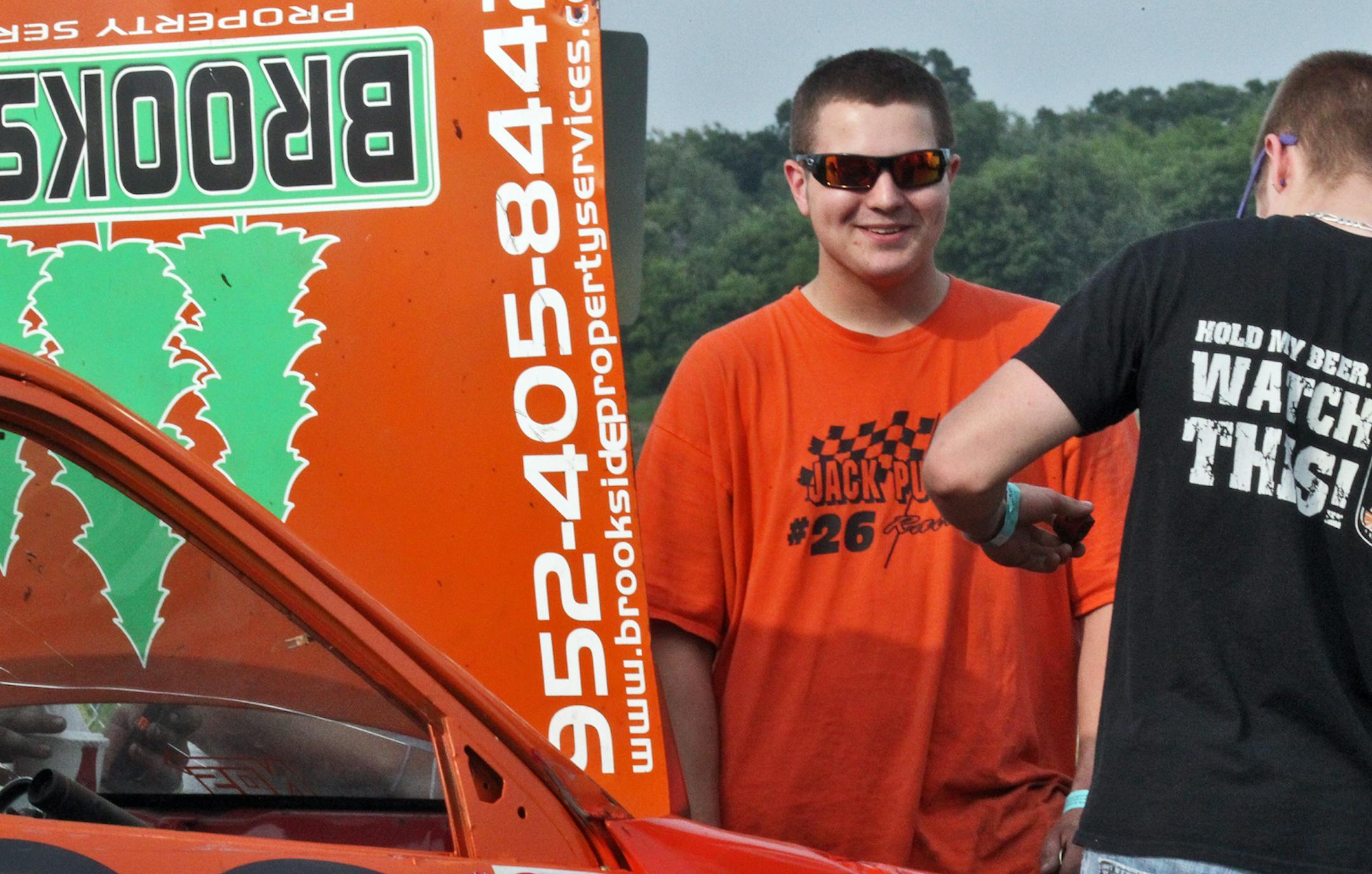 Area high school students are making their presence known in the local car racing scene. Brothers Matthew Ostdiek, 18 and Michael Ostdiek, 16, both of Lakeville race their vehicles at Elko Raceway. Matthew Ostdiek races vechicle #40 in the Super Late Model feature while Michael Ostdiek races vehicle #40 in the Legends feature. Student Jack Purcell of Bloomington races vehicle #26 in the Mini Stock feature. Jack Purcell talked to a mechanic about his race car. (MARLIN LEVISON/STARTRIBUNE(mlevison