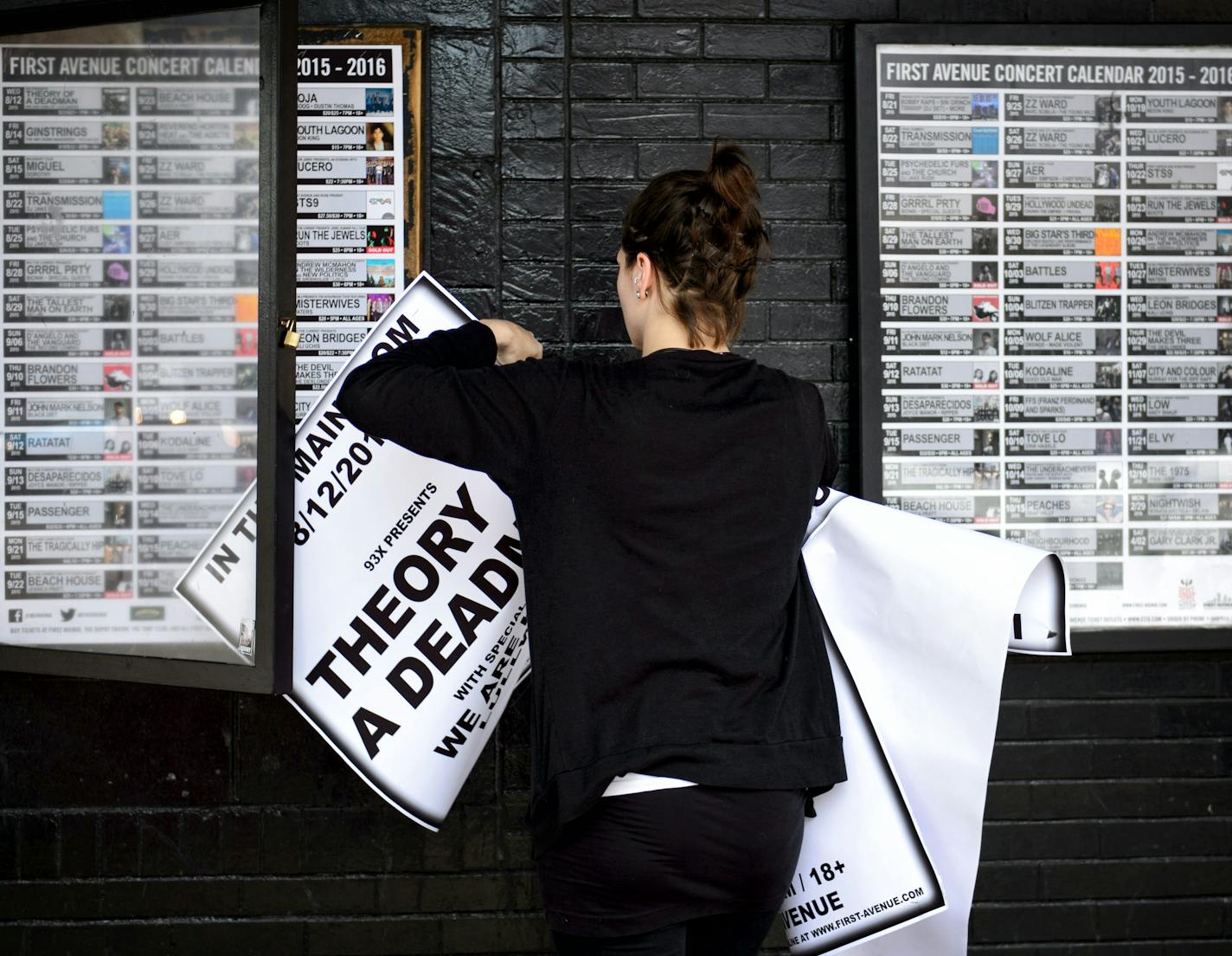 A First Avenue staffer took down posters from the prior night for Theory of a Deadman, who was playing in the Minneapolis club when a section of the ceiling collapsed. [Thursday, August 13, 2015]