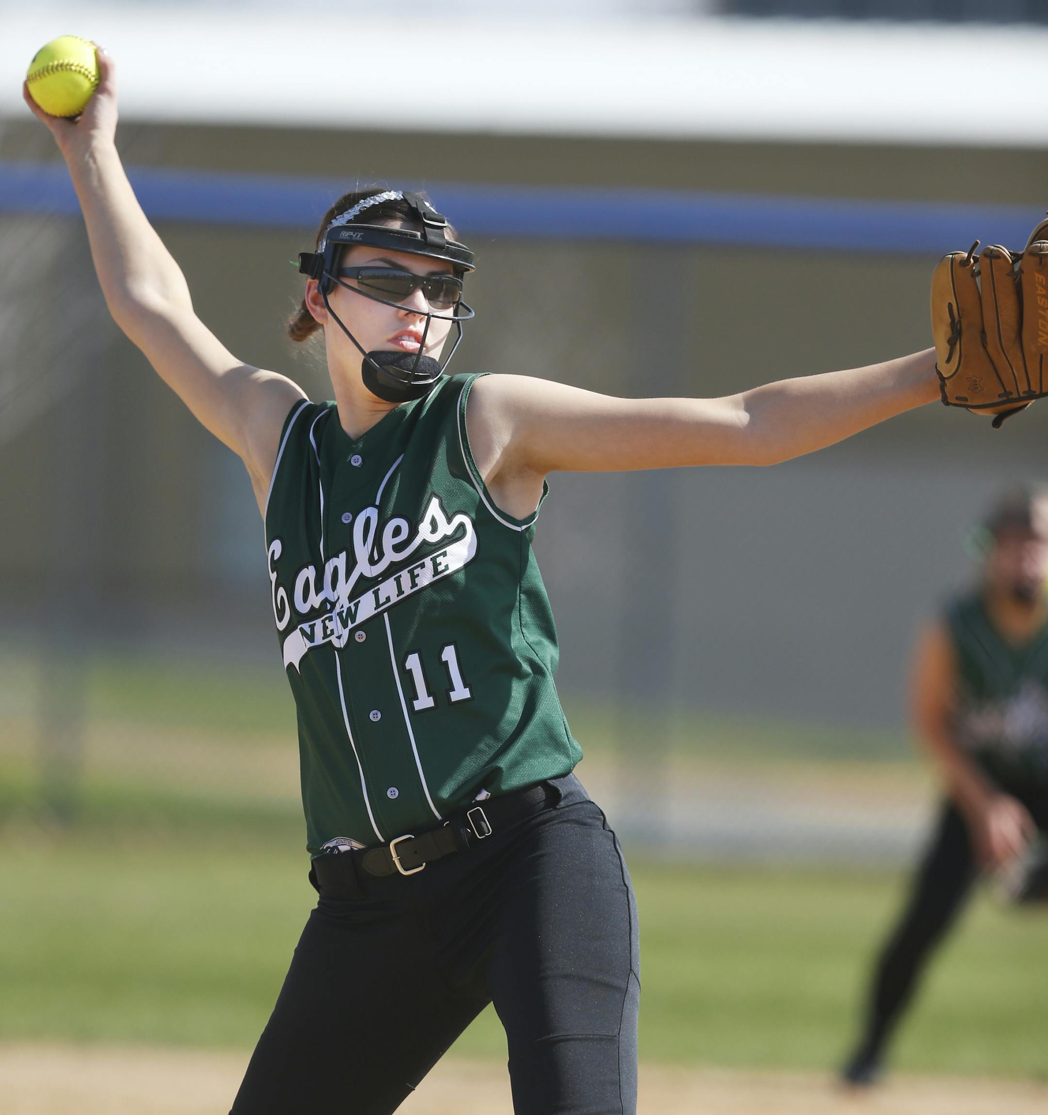 At Bielenberg Sports Complex in Woodbury, New Life Academy Valerie Hohol(11) pitched against Holy Family in a game.]richard.tsong-taatarii/rtsong-taatarii@startribune.com