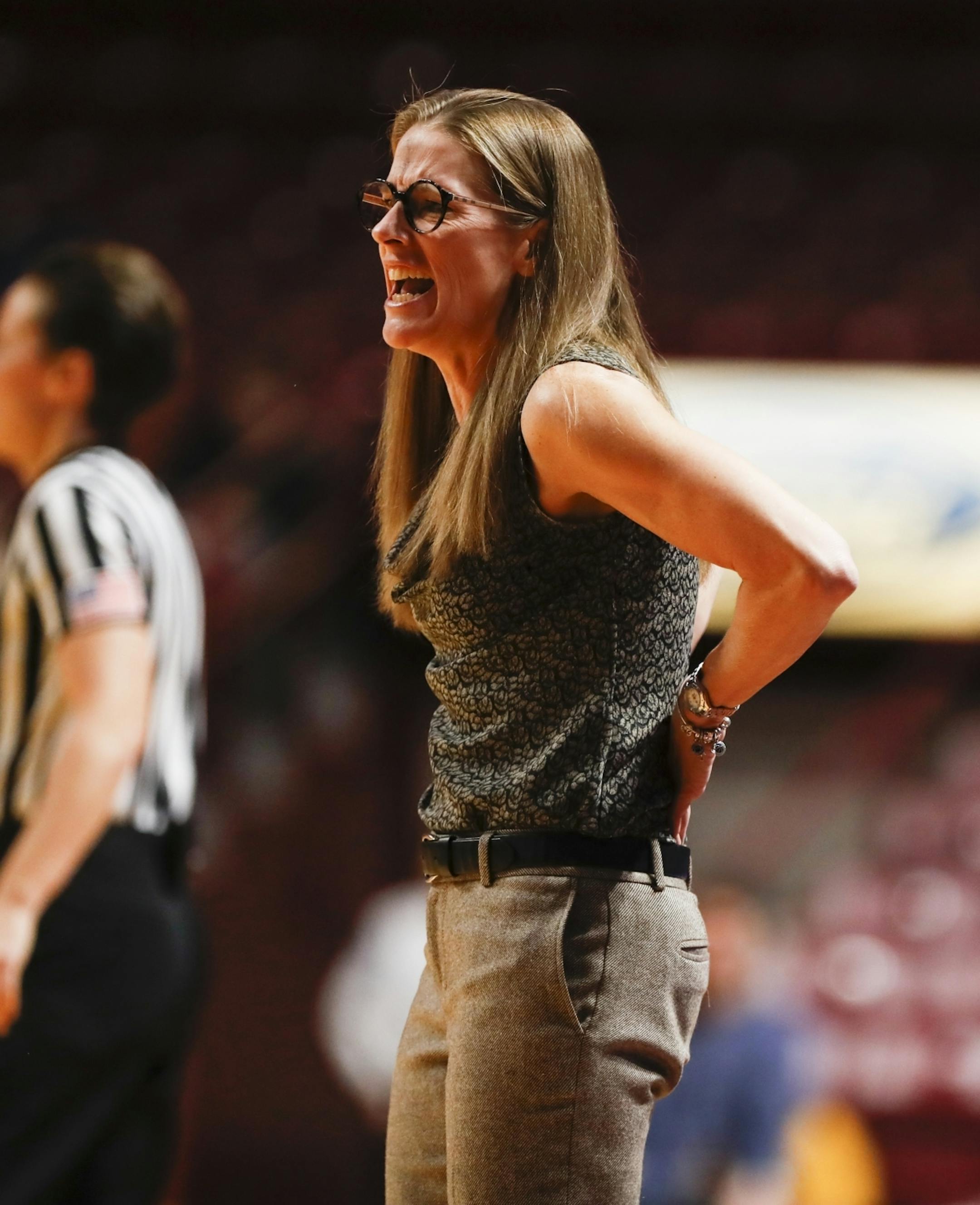 Michigan Wolverines head coach Kim Barne Arico in the first half