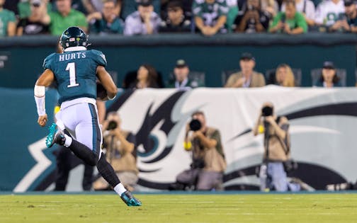 Philadelphia Eagles quarterback Jalen Hurts runs in for a touchdown in the second quarter.