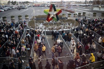 The line moves outside the north entrance as the mall opens for Black Friday shopping Friday, Nov. 25, 2022 at the Mall of America in Bloomington, Min